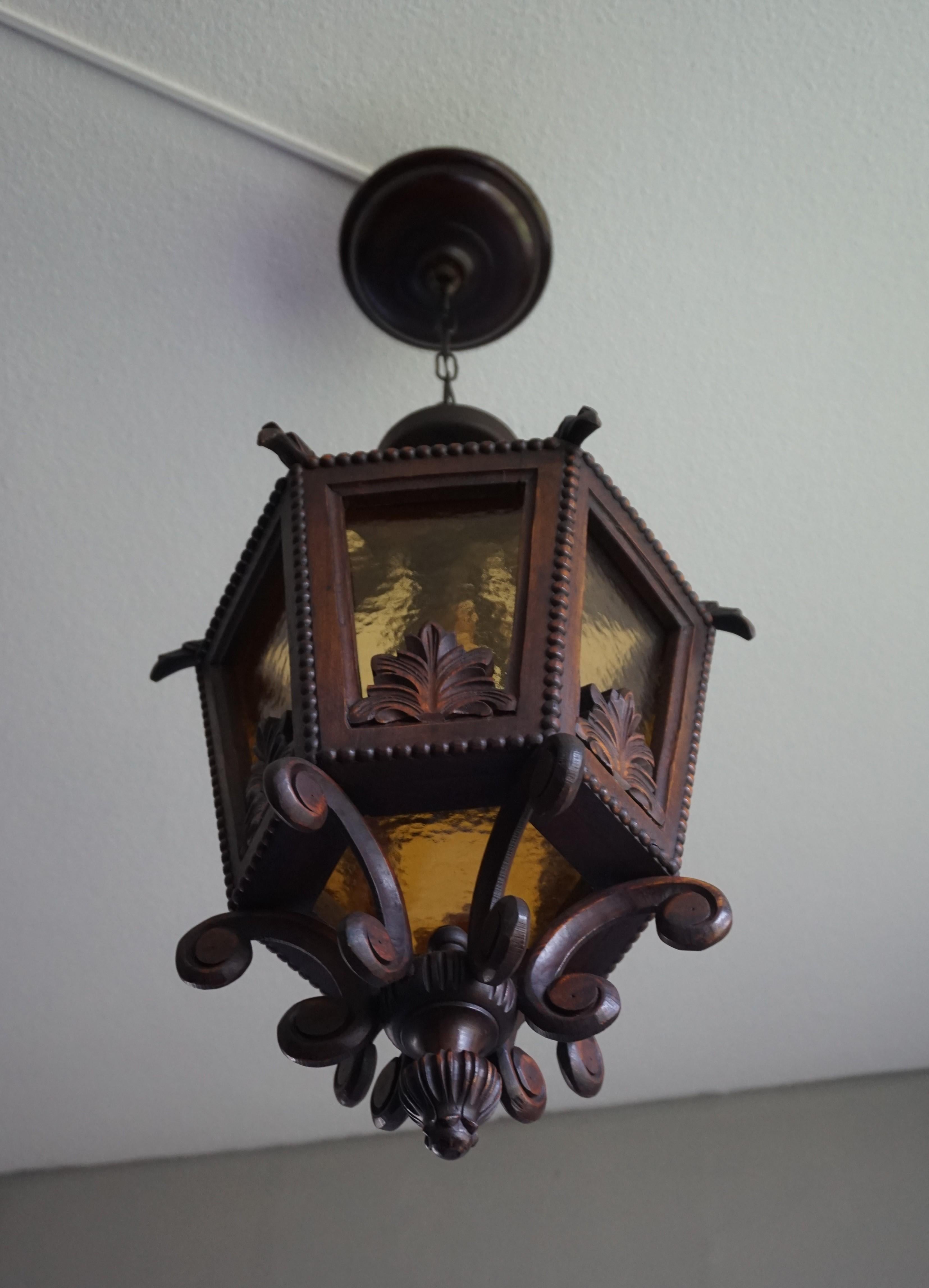 Renaissance Revival Large Hand Carved 20th Century Wooden Pendant Light with Amber Glass Panels