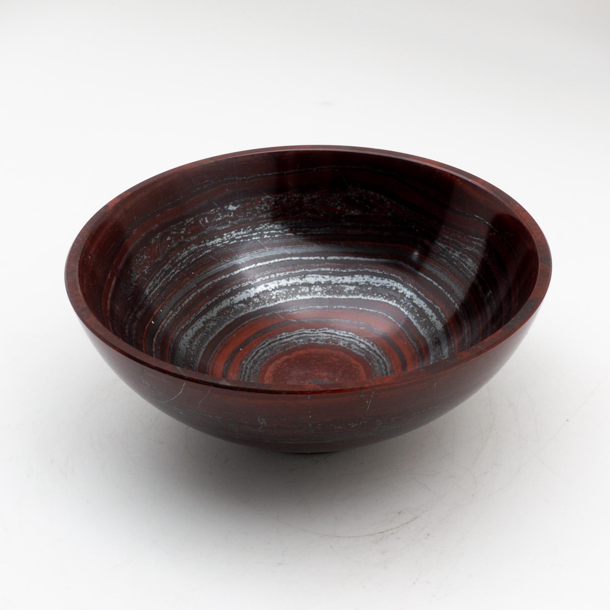 Hand carved and polished bowl, featuring bands of haematite (silver) alternate with bands of jasper (red). This 6