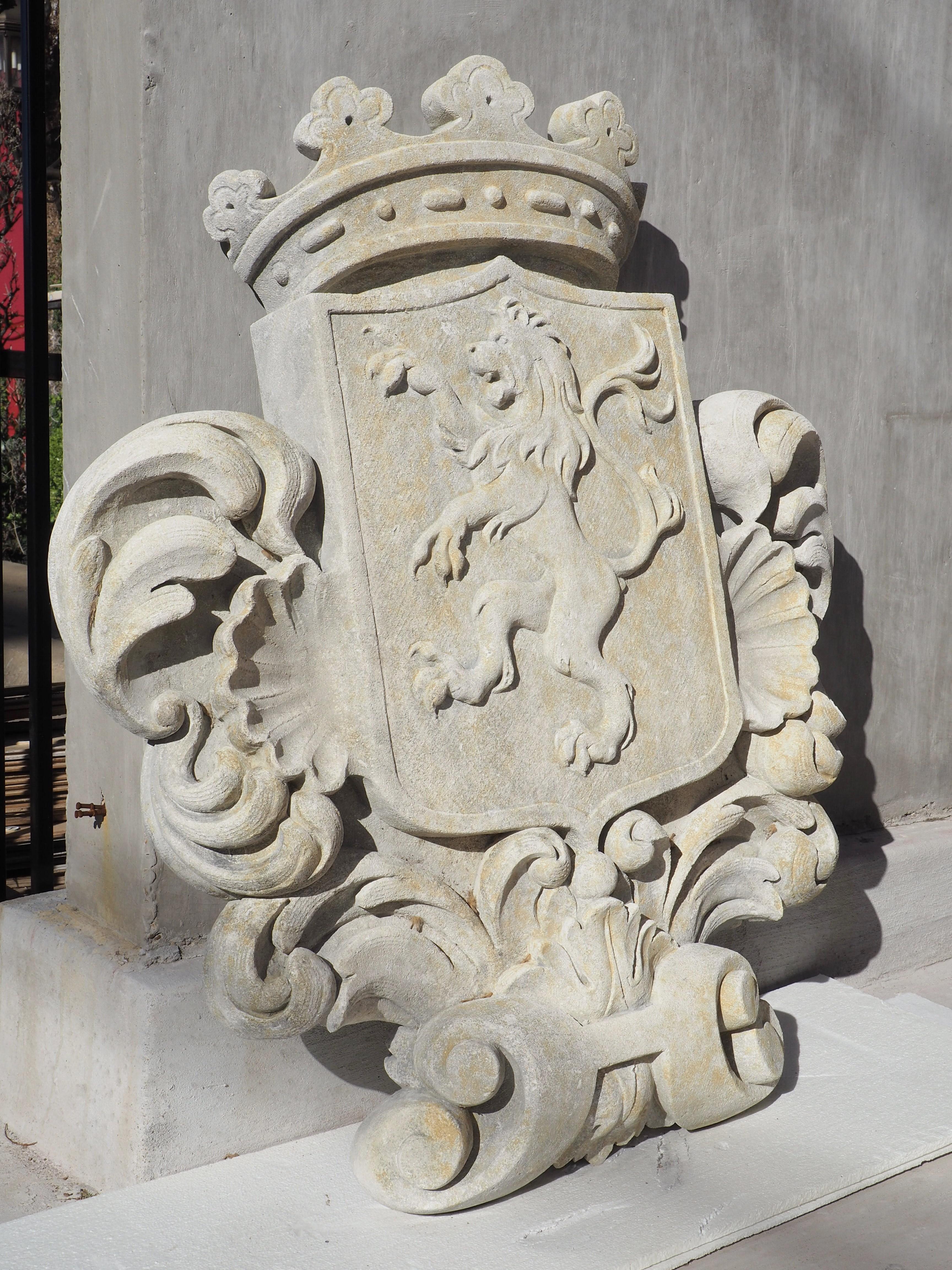 This large stemma plaque was hand-carved out of a solid block of limestone in Italy by a highly skilled artist. The coat of arms is based on a French style escutcheon, but with a nicked top. An open crown has been carved above the shield which
