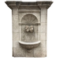 Used Large Hand-Carved Limestone Wall Fountain from France Featuring Grapevine Spout