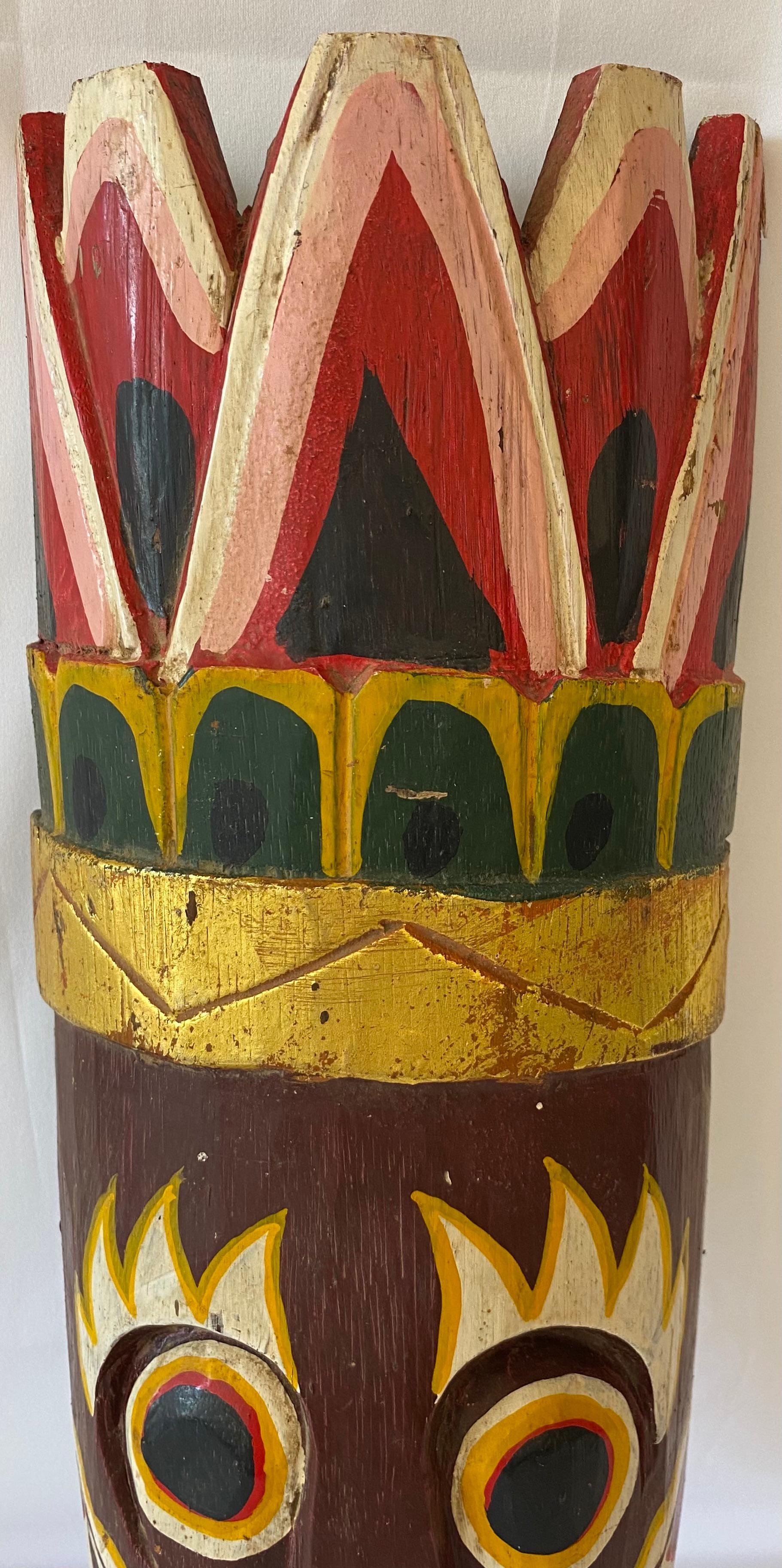A generously sized wooden tribal mask. 

Hand-carved and painted this decorative mask that would look great in a western or country themed setting. 

Measures: 19