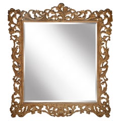 Grande specchio con cornice in legno biondo decapato intagliato a mano