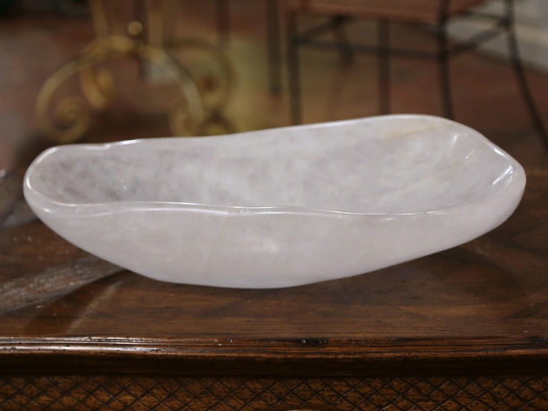This important hand carved rock crystal bowl was crafted in Brazil, the heavy dish with natural scalloped edges is in excellent condition with a rich patinated clear finish. Place this decorative dish as a dining room center piece, or use it as a