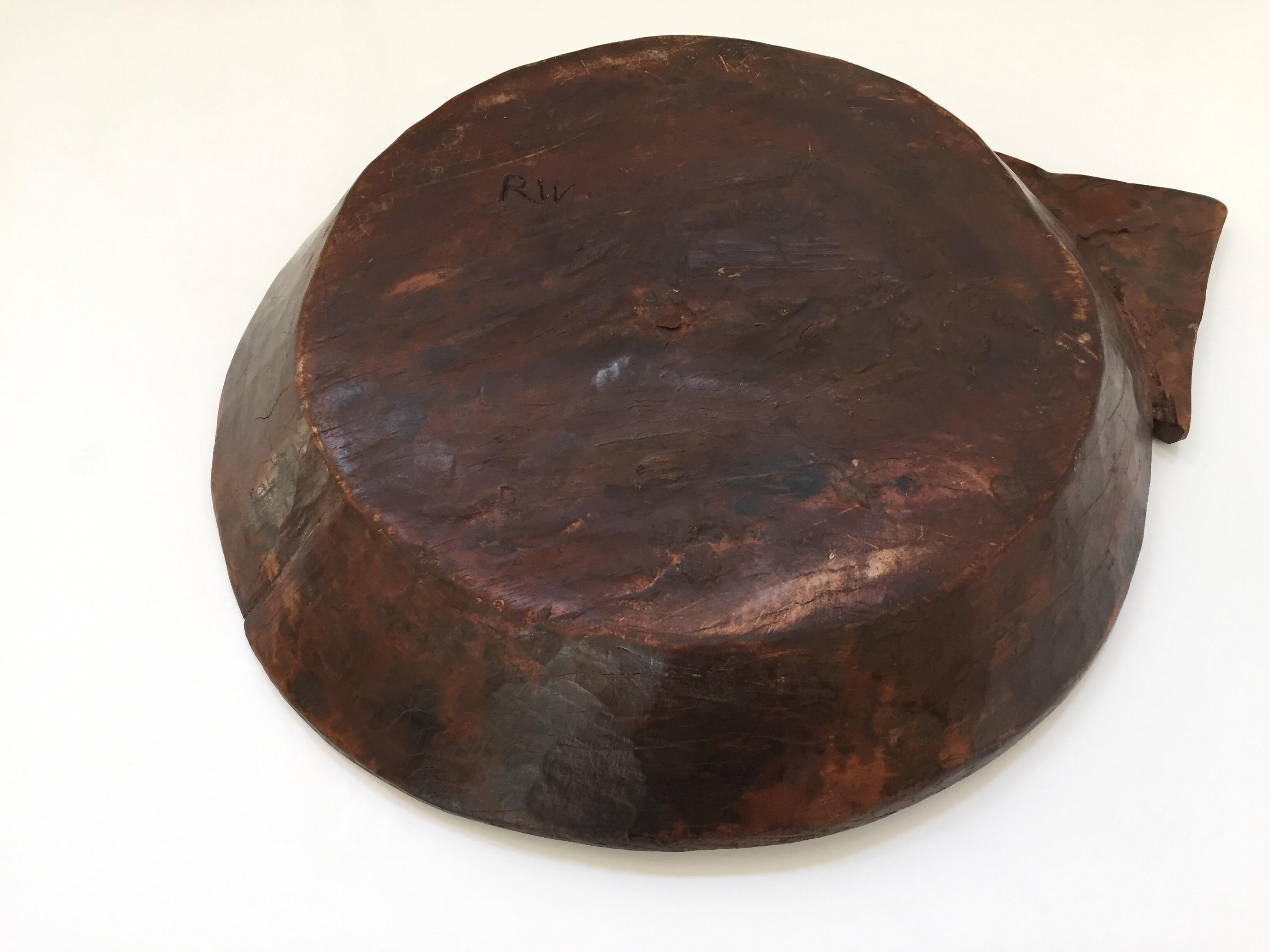 Large tribal wooden bowl or tray from the Batak of Sumatra, mid-20th century.
Scaramanga's bowls are authentic old hand carved wooden bowls with small marks, imperfections and variations in color, which are consistent with their age and original