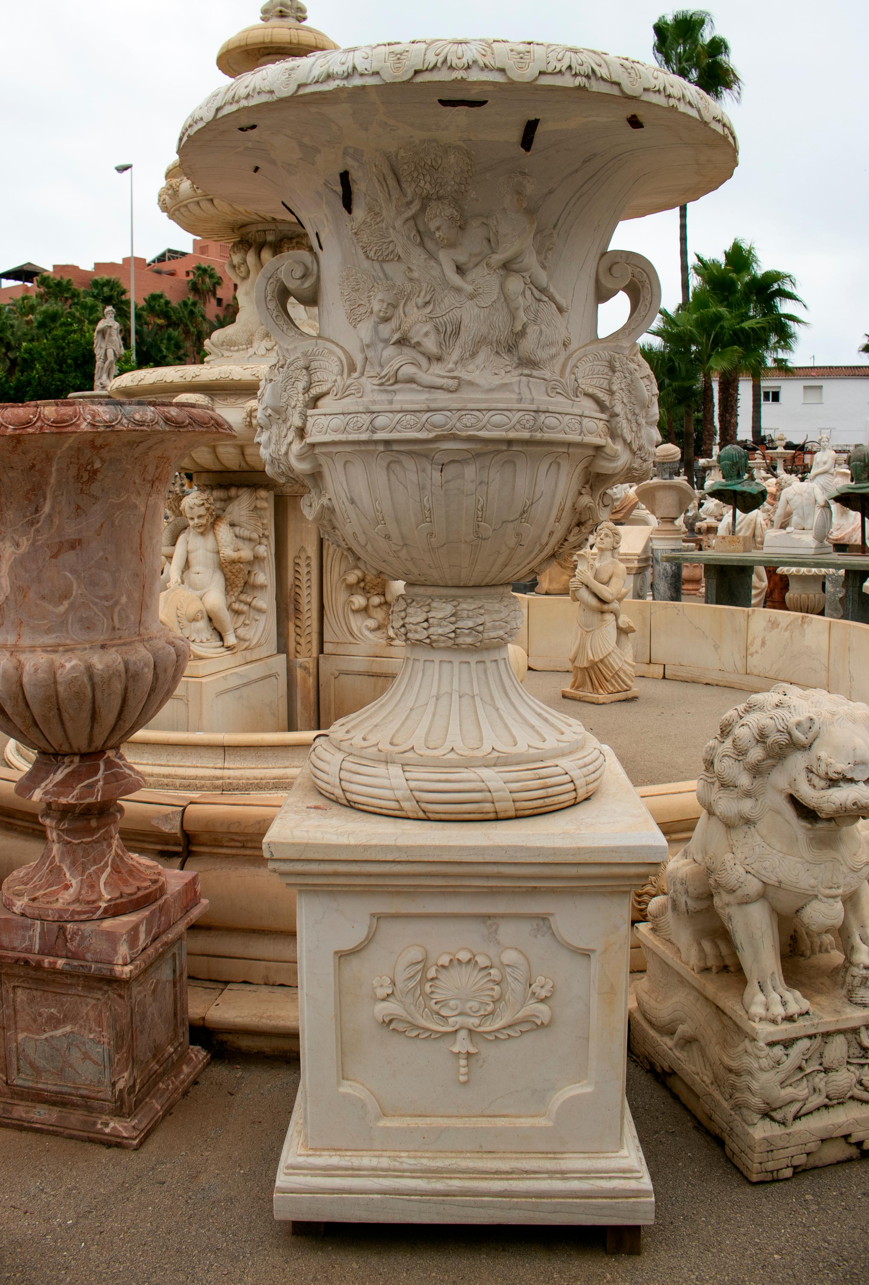 Large hand carved white marble planter or urn with base or plinth.

Planter dimensions: 140 x 120cm
Base dimensions: 81 x 76 x 76cm.