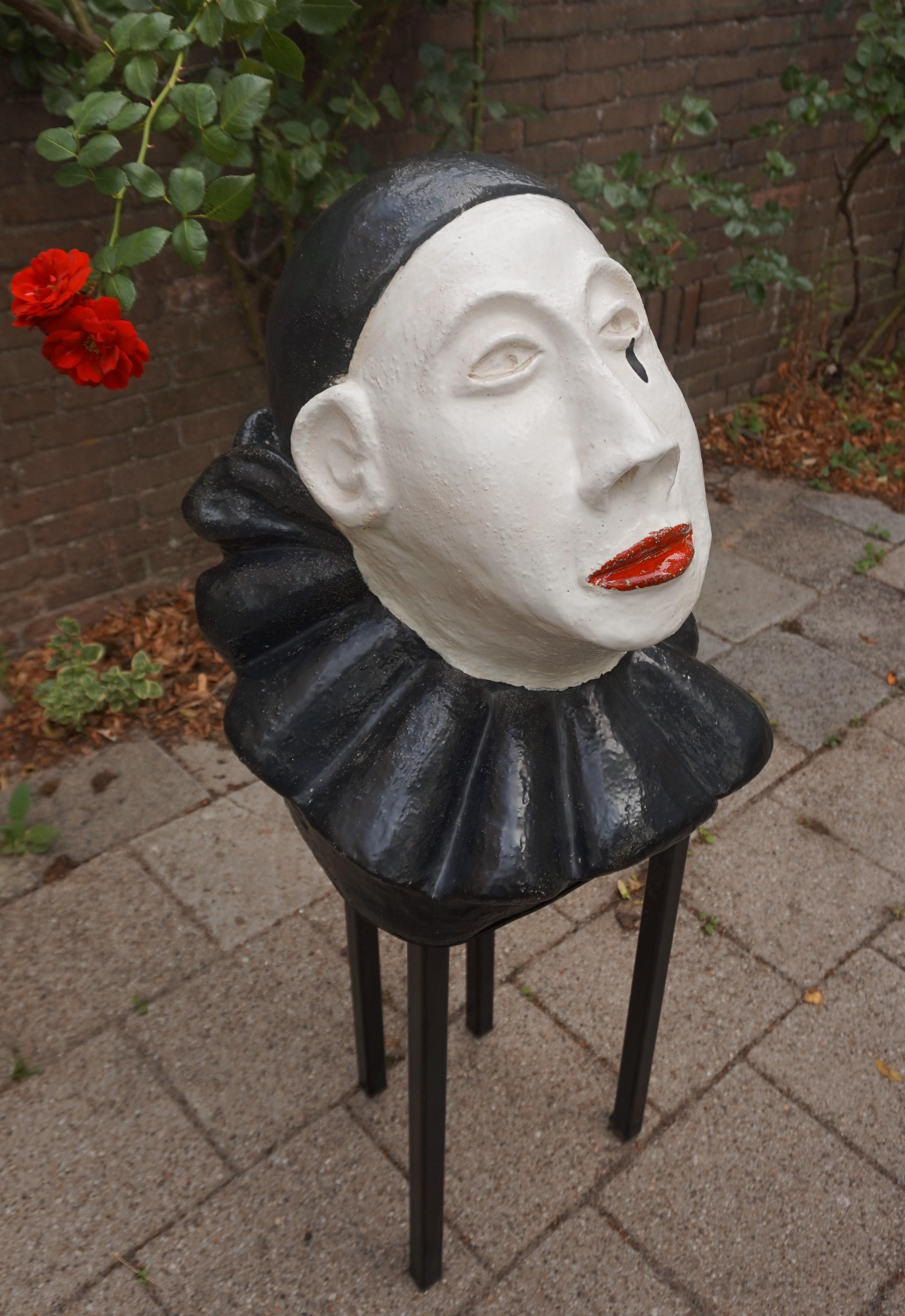 One of a kind and impressive pierrot sculpture on an iron base.

Born as one of the archetypes in the early 18th century, Italian 'commedia dell'arte', the Pierrot (or Pedrolino) character has, over the centuries, become worldfamous. The story and