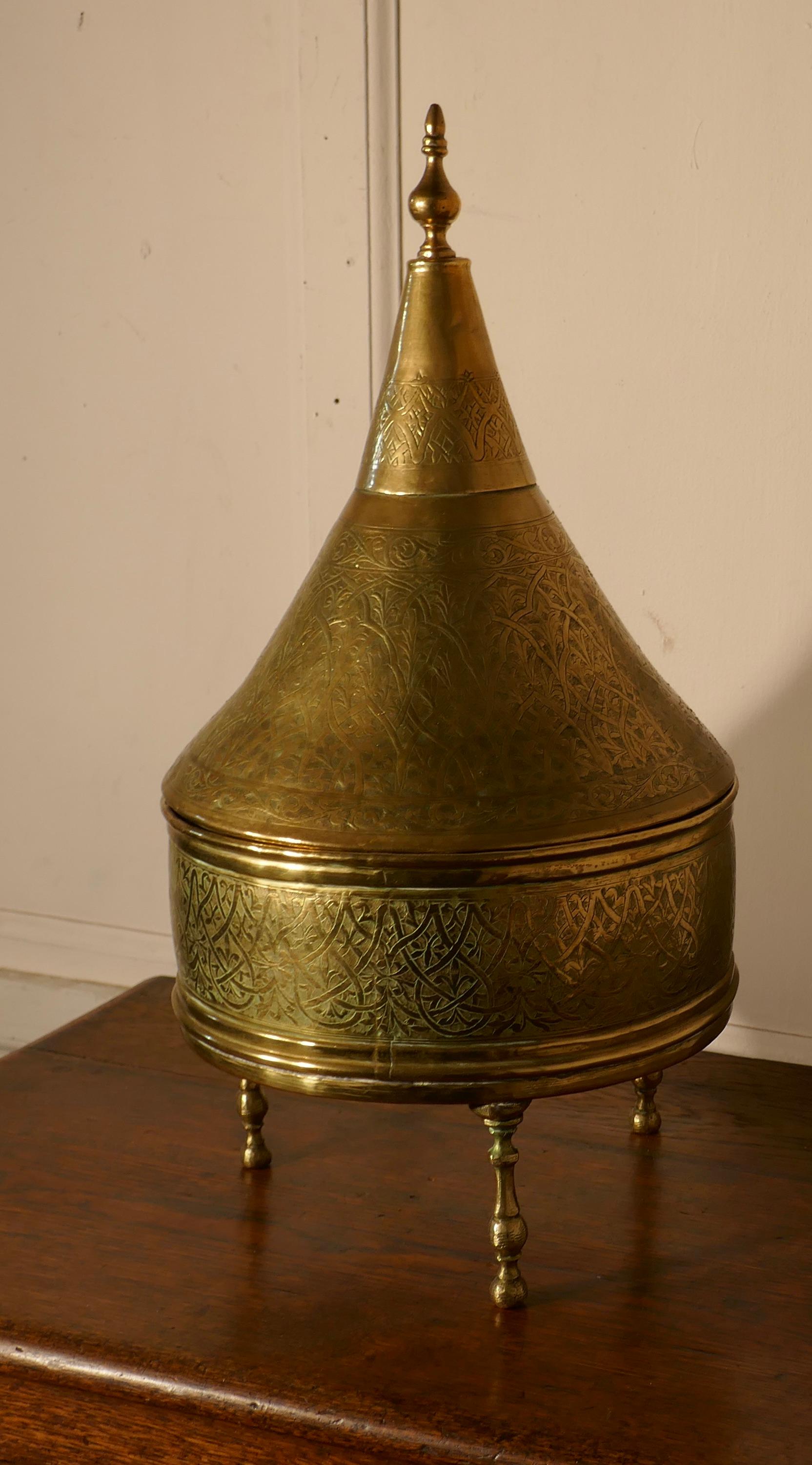 Large handmade Moroccan tagine dish with cover


Large handcrafted tagine with cone cover and a brass final the tagine stands on legs and is in good used condition.
The tagine has a decorative hand beaten Ottoman designs all over the