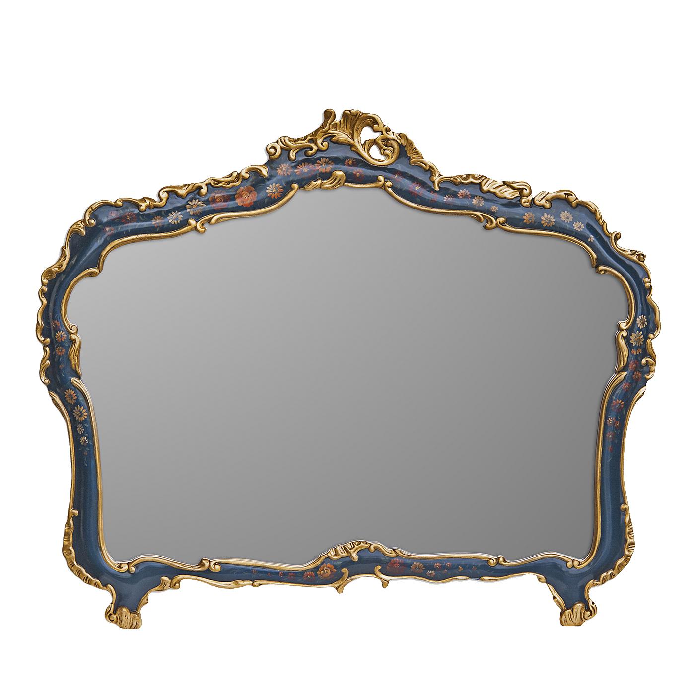 This magnificent mirror is an example of masterful craftsmanship. The large mirror is adorned with a thin frame in solid wood that was finely carved by hand and then hand painted. The vivid blue of the background is punctuated with elegant red and