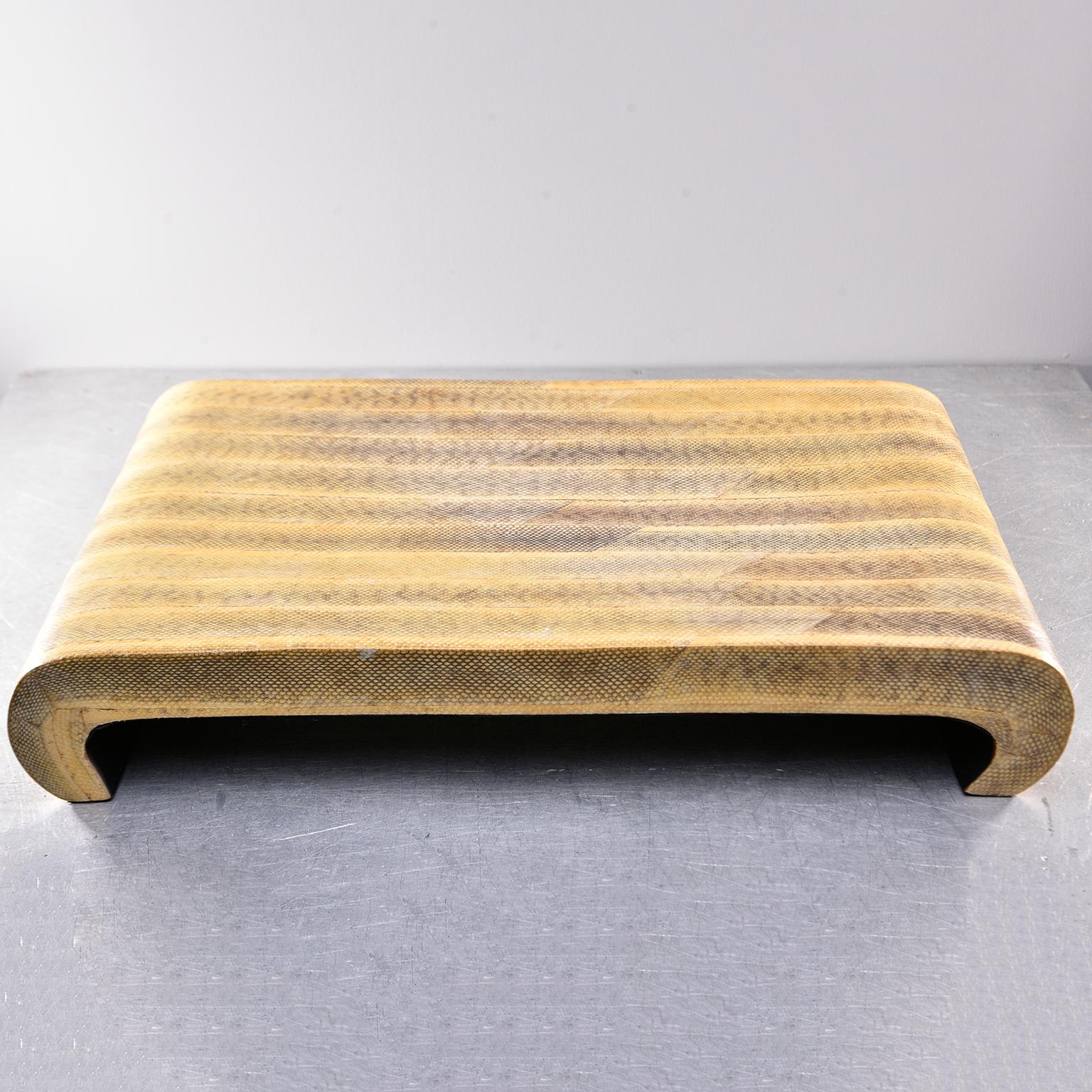 This large platform-style tray is just under two feet wide and features subtly under-curving legs, genuine snakeskin leather that has been hand painted to accentuate the color and pattern. New item handmade in Italy.