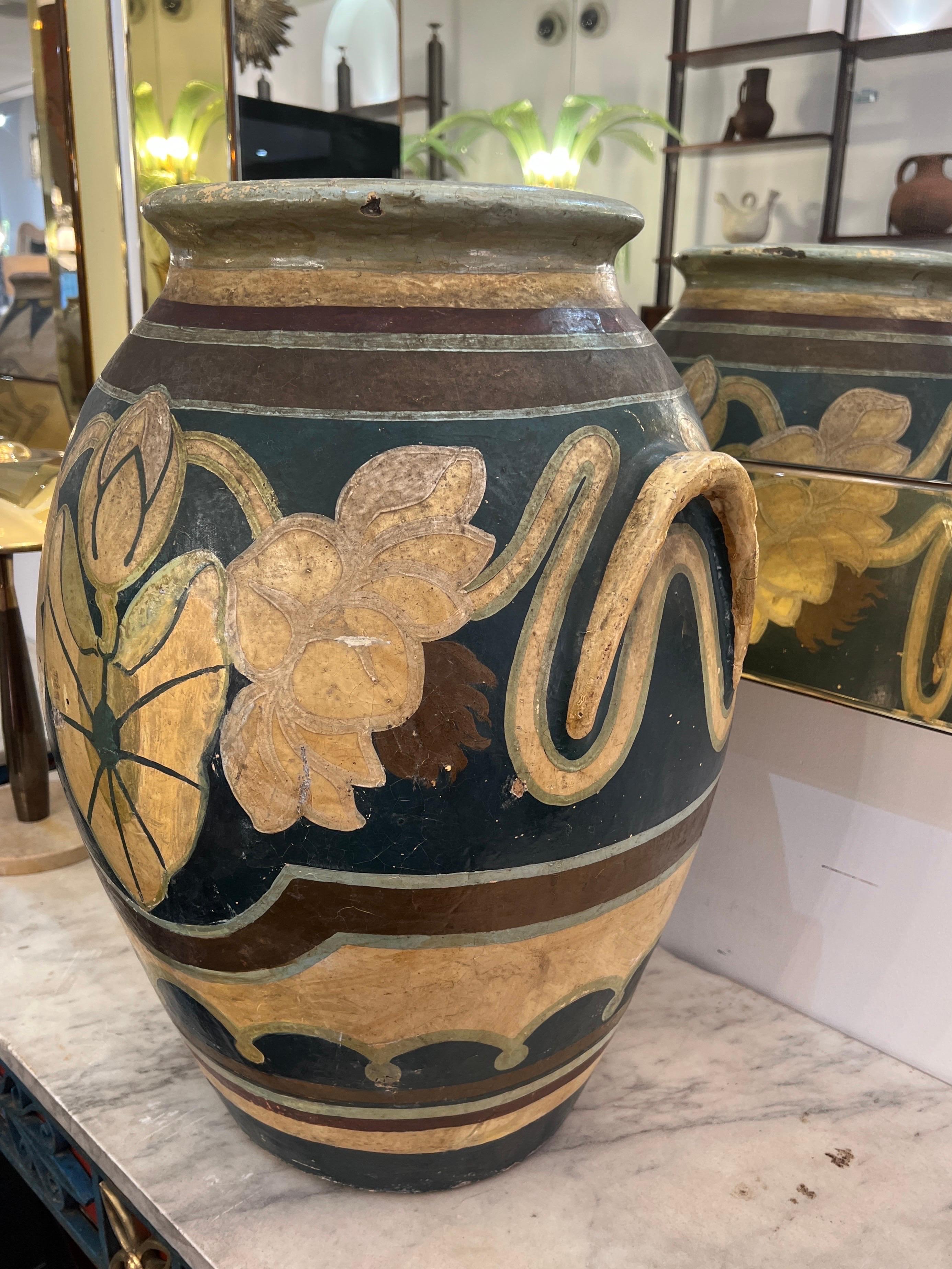 This beautifully hand painted urn was acquired from a Tuscan palazzo along with another piece (see our other listing) fabulous details in Tuscan yellow, blue, green and red colours and motifs . C1920s 
Measurements: H60cm (23.75in) Diameter 45cm