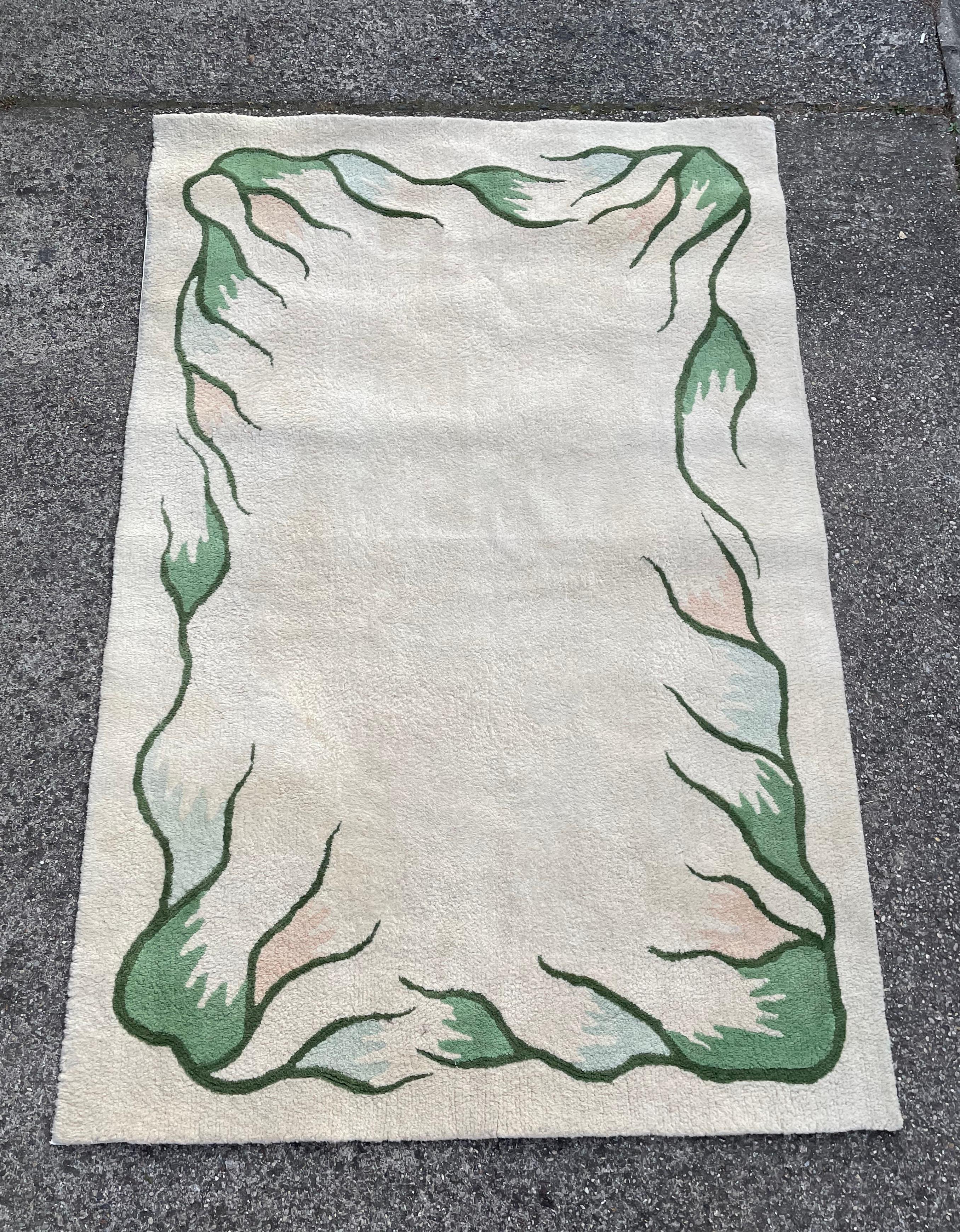 Vintage European hand-tufted wool rug.

Age: ca1960s

Made of wool, with beautiful floral decoration in green color with pale blue and pink details.

The rug remains in very good vintage condition, with small traces of cosmetic wear, as seen