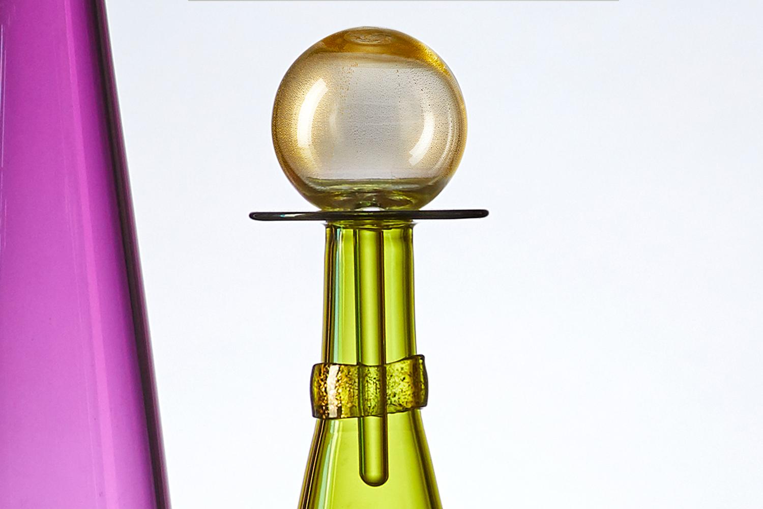 Contemporary hand blown glass carafe in geometric cone form, inspired by Mid-Century Modern design. Coordinated neck-wrap and blown glass stopper are finished with gold-leaf, a metallic complement to the translucent chartreuse hue, 