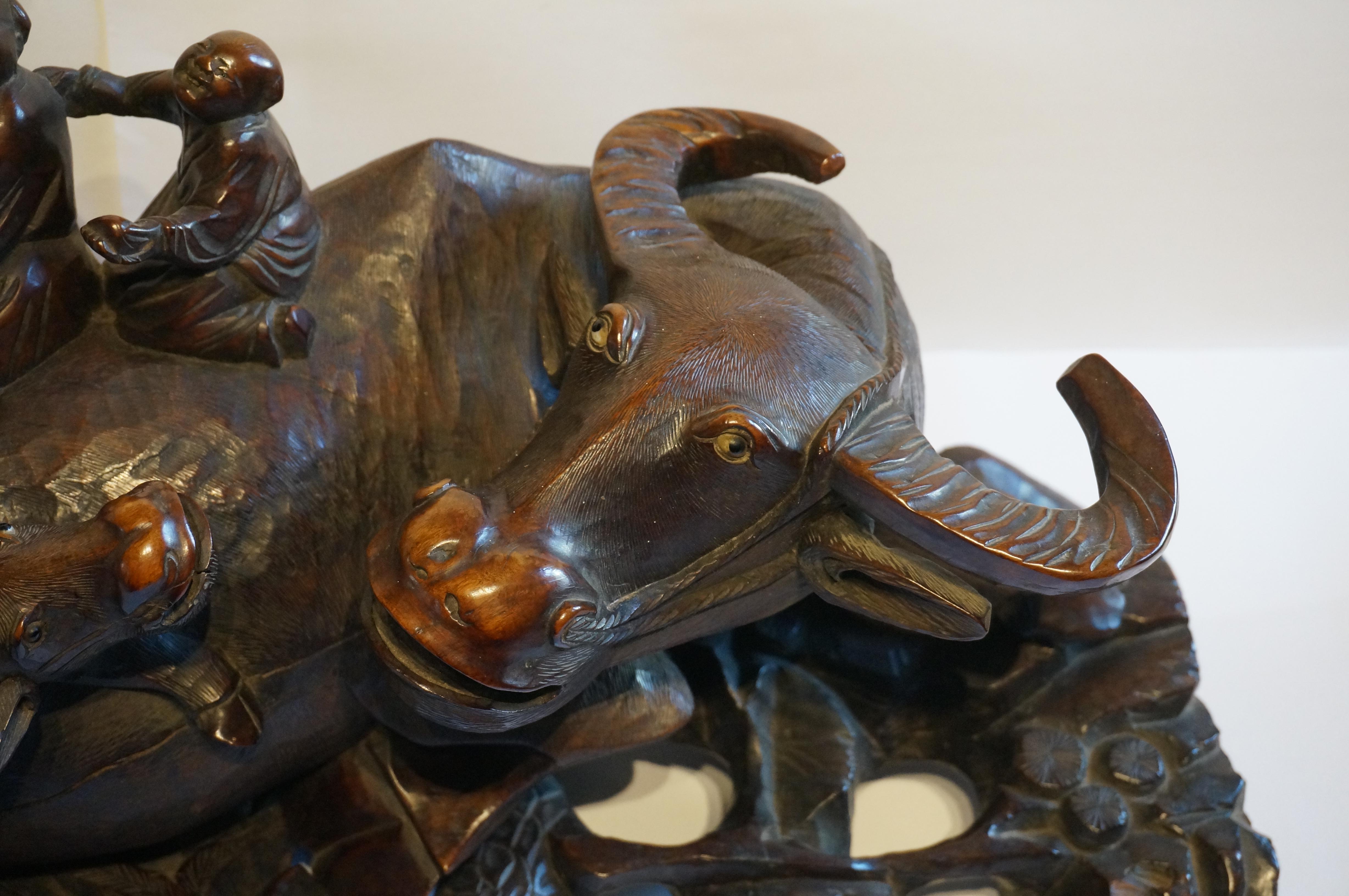 Chinese Large handcarved Asian wooden sculpture of a water buffalo with calf and figures For Sale