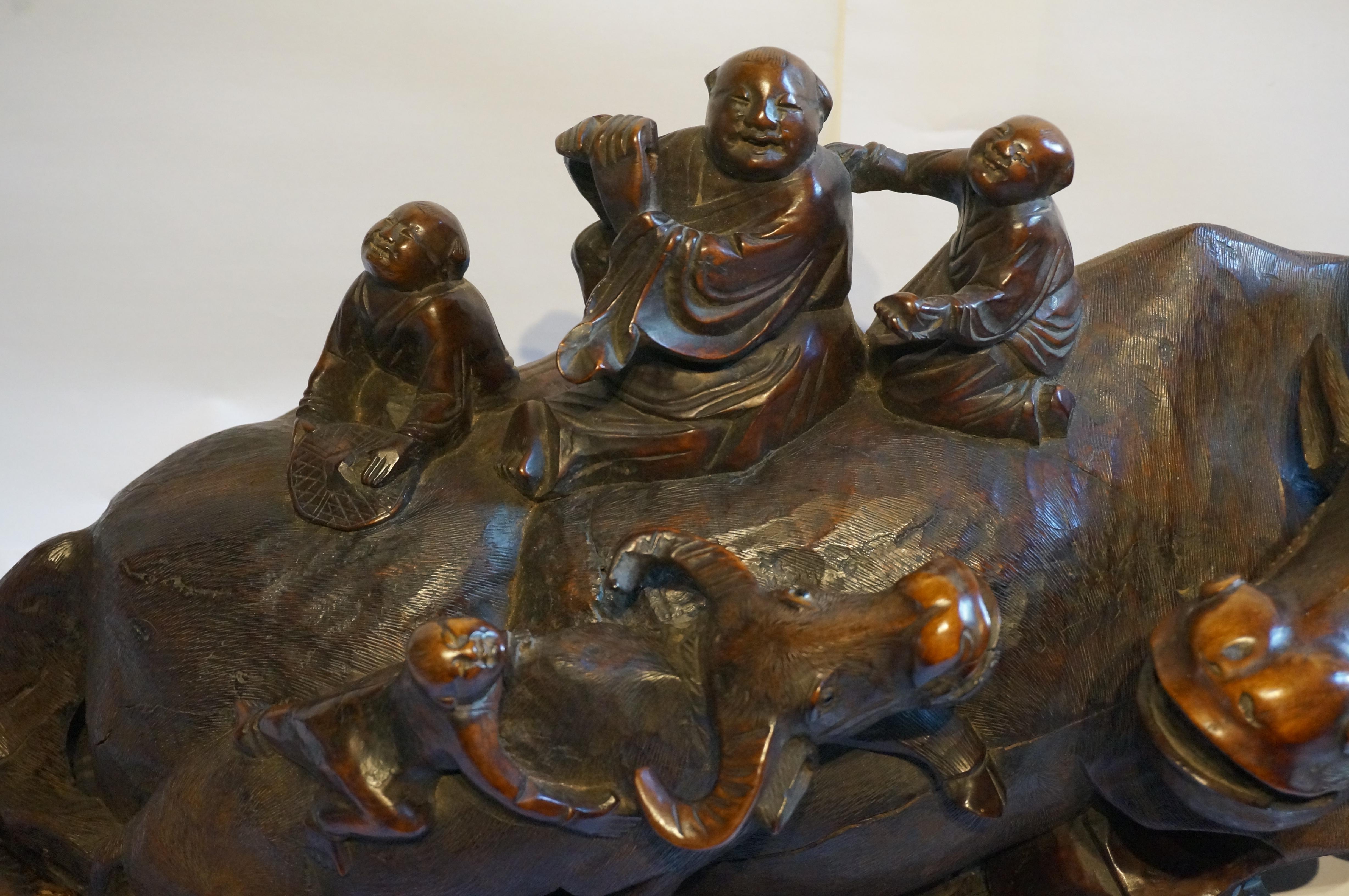 Large handcarved Asian wooden sculpture of a water buffalo with calf and figures In Good Condition For Sale In DEVENTER, NL