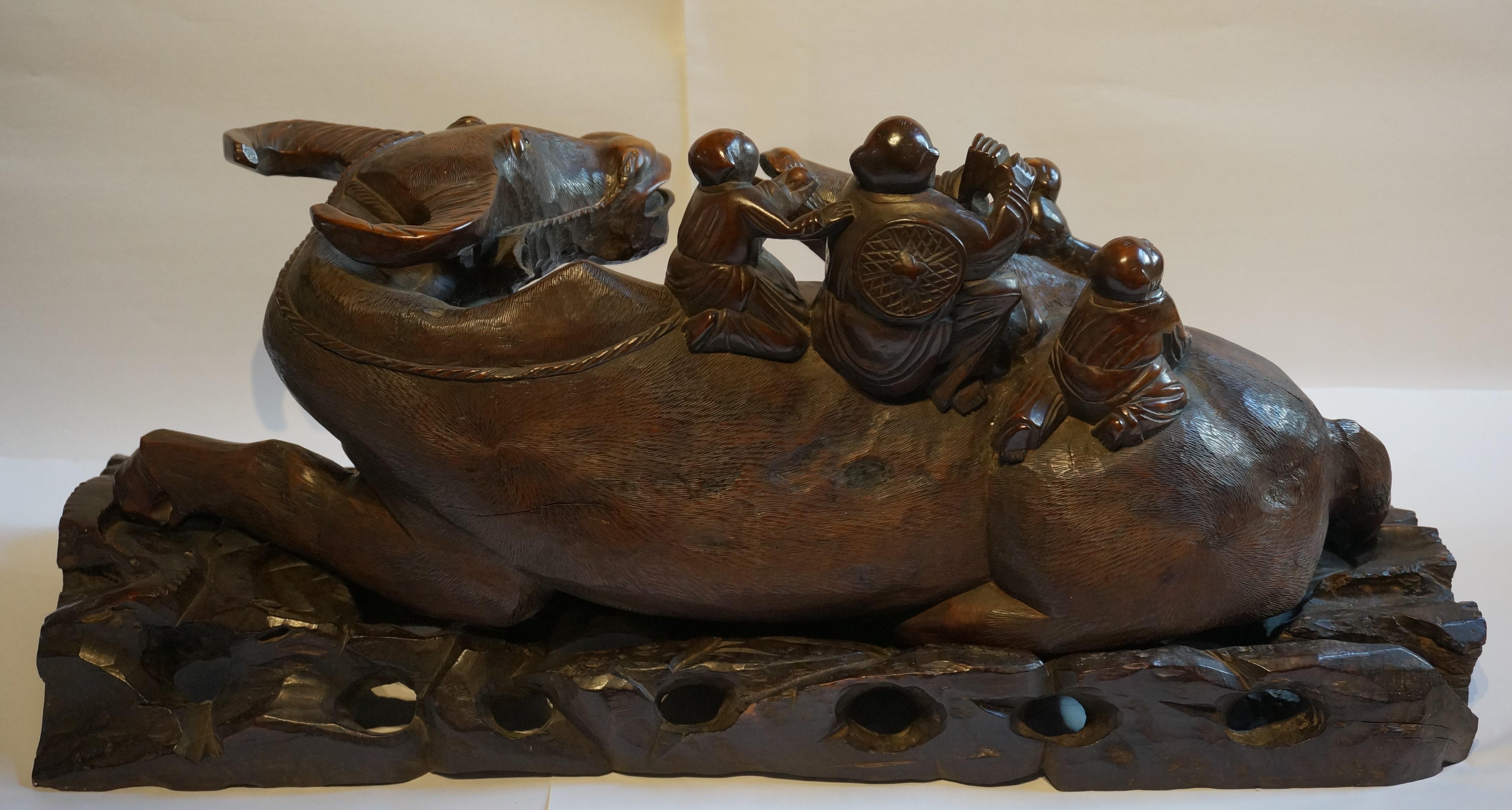 Large handcarved Asian wooden sculpture of a water buffalo with calf and figures For Sale 1
