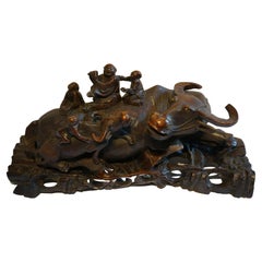 Antique Large handcarved Asian wooden sculpture of a water buffalo with calf and figures