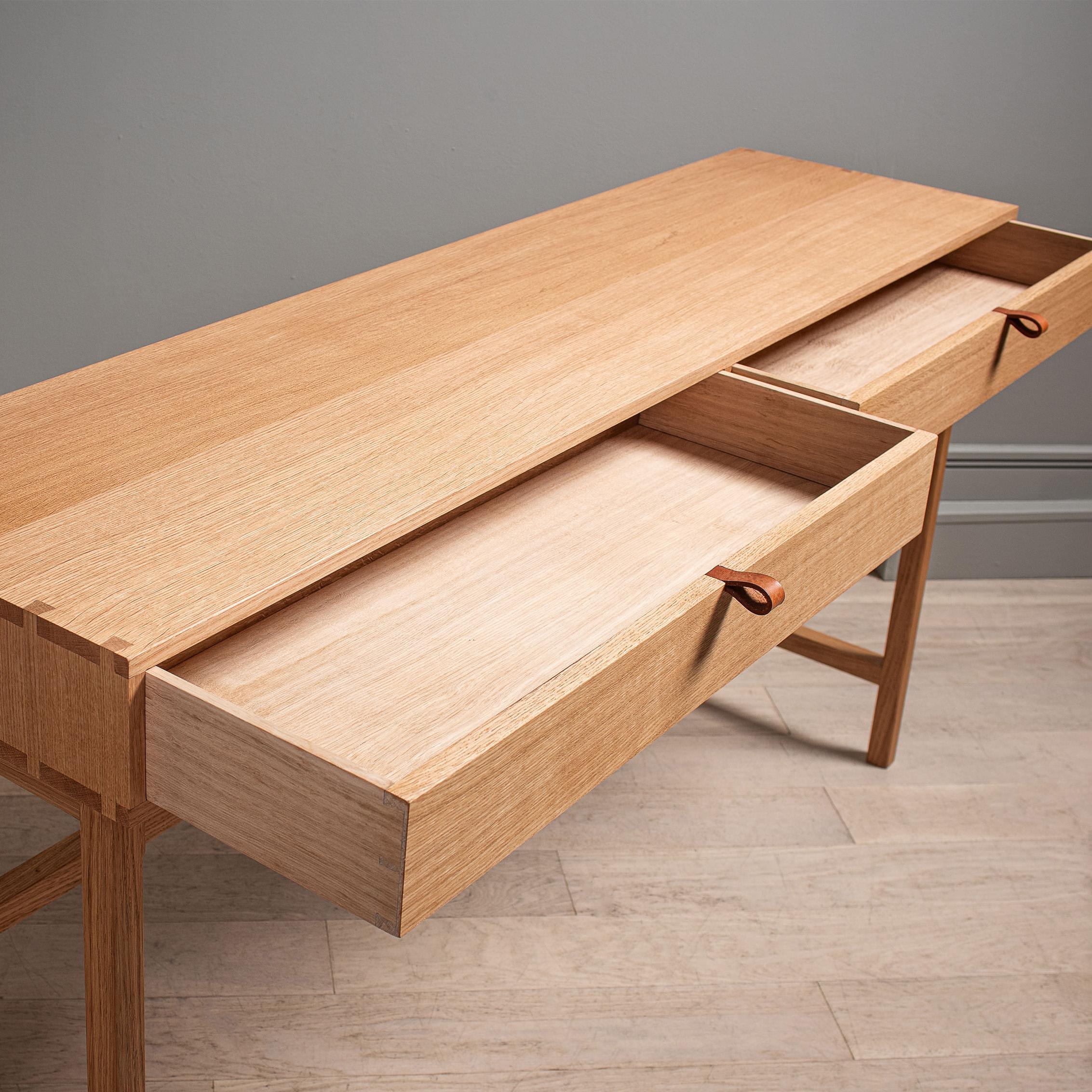A new large freestanding incarnation of our modernist handcrafted English oak console table. Designed and handmade in England using skilled traditional furniture making techniques. Completely handcrafted from the finest fully quarter-sawn English