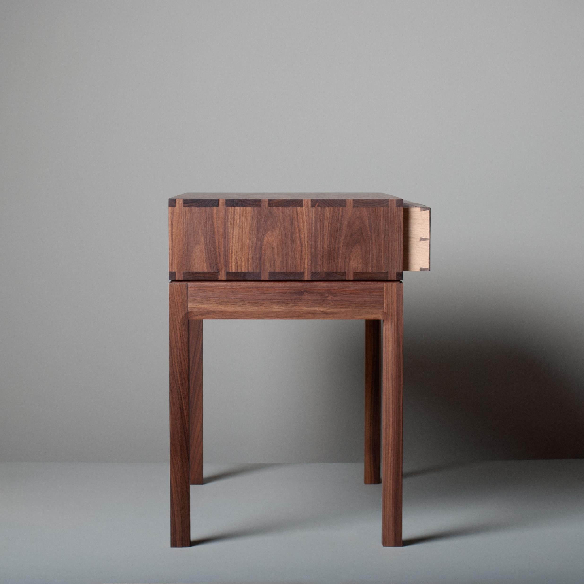 An alternative version, in much larger proportions, of our American black walnut hand-crafted nightstands - end tables in a modernist design. These are constructed from the finest American black walnut with the inner dovetailed jointed traditional