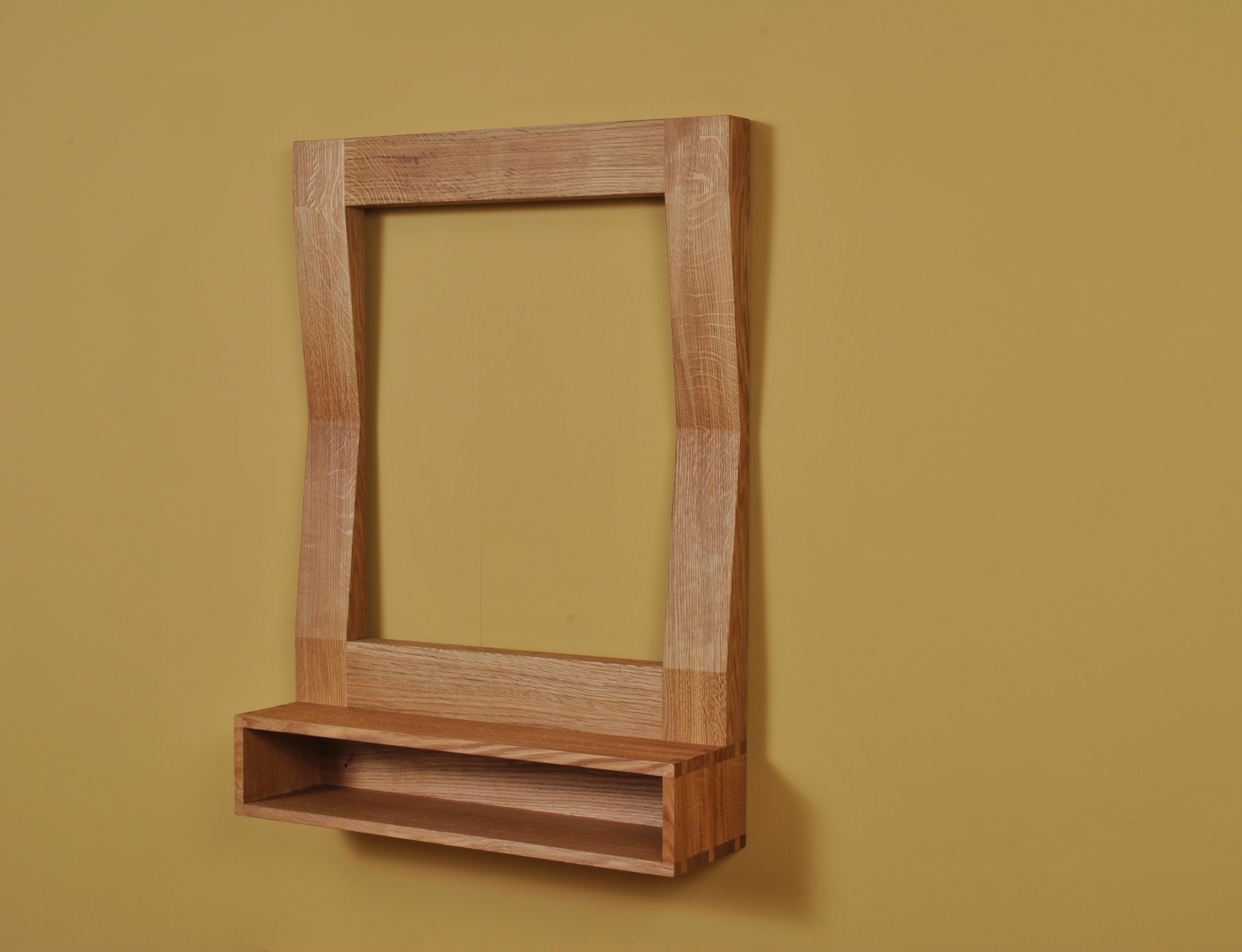 Large handcrafted ‘furrow’ oak framed mirror with shelf. The mirror glass is fitted by us in either standard silver or ‘bronzed’ (see image) mirror glass. Designed by SUM furniture and handcrafted in finest fully quartersawn English oak. Hand