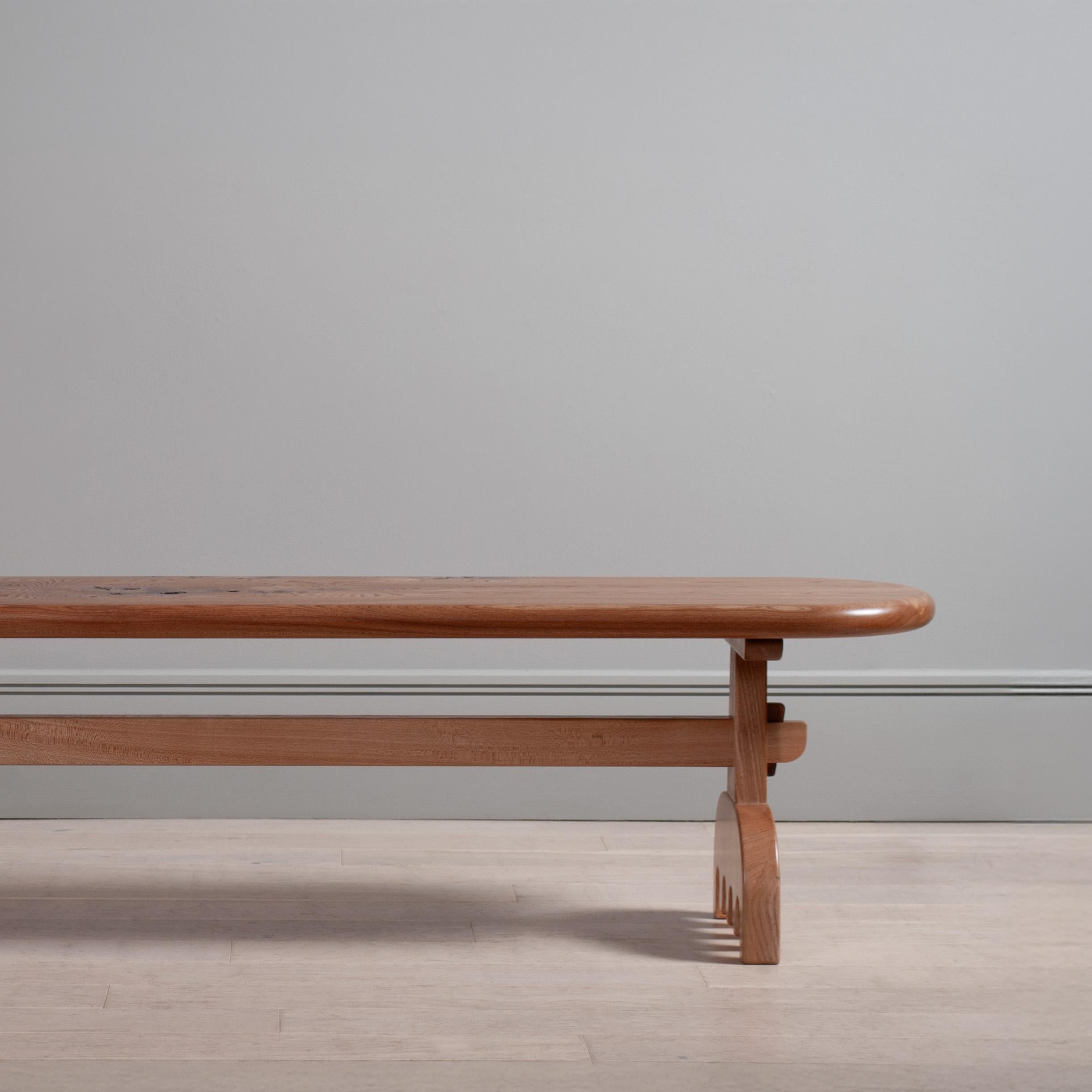 Solid Scottish Elm contemporary refectory bench. Handcrafted with wedged mortice and tenon joints on the legs and wiggly feet. Based on traditional construction, with a chunkier and playful twist.

This table is made from solid timber, intelligent