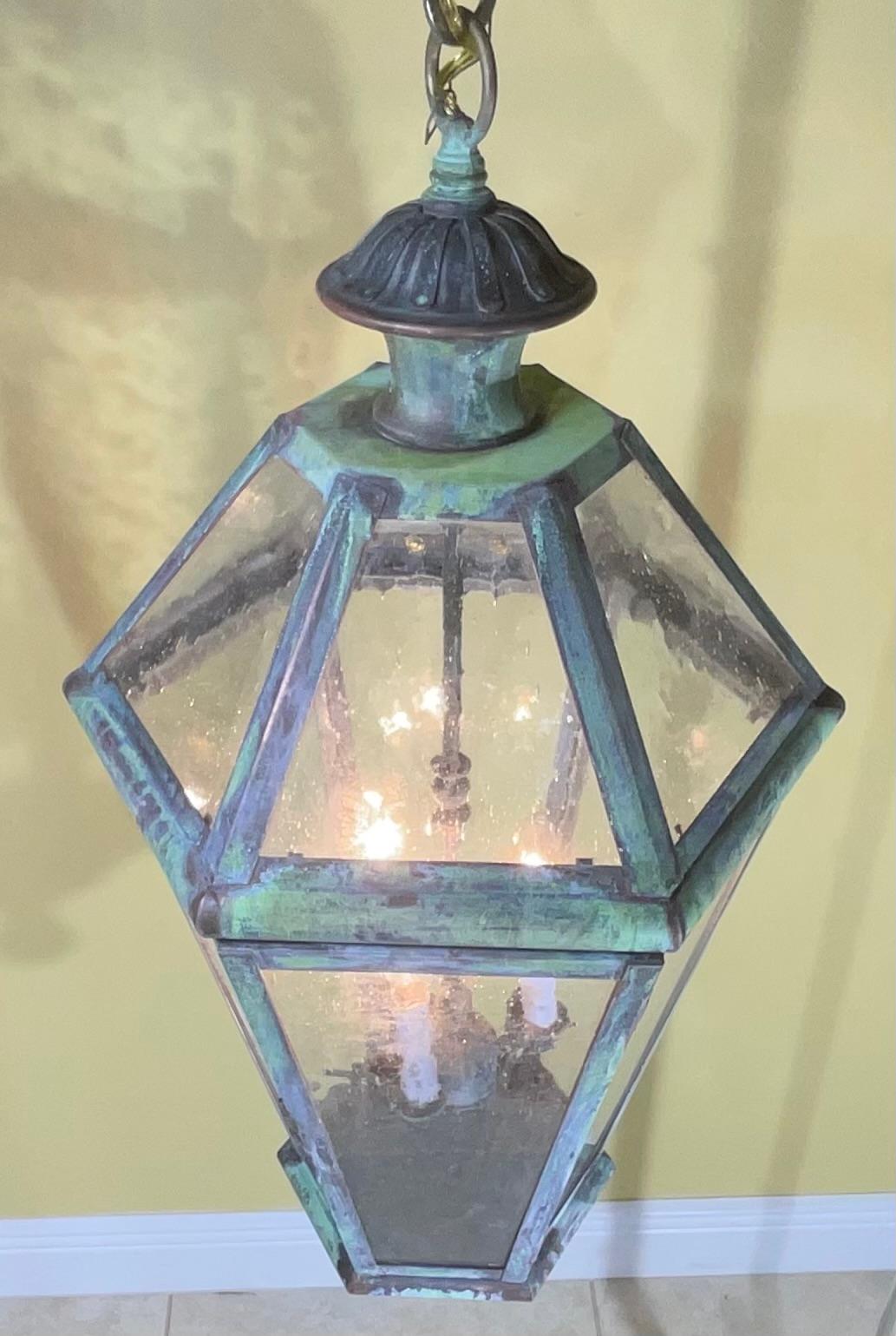 
six side hanging lantern ,made of handcrafted solid brass with three 40/watt lights, decorative seeded glass ,great light exposure , nice patina ,suitable for wet location
great look indoor outdoor.
canopy and chain included.