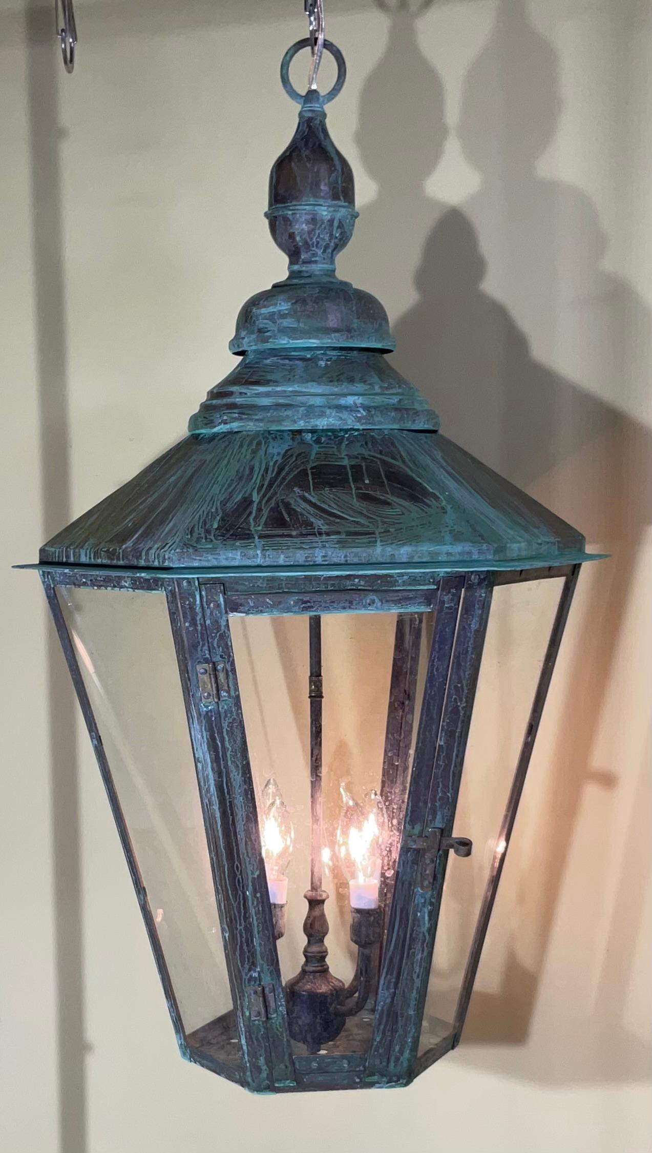 
Exceptional six side hanging lantern ,made of handcrafted solid copper and brass stem with three 60/watt lights, great light exposure , nice patina ,suitable for wet location
great look indoor outdoor.
Copper canopy and chain included.