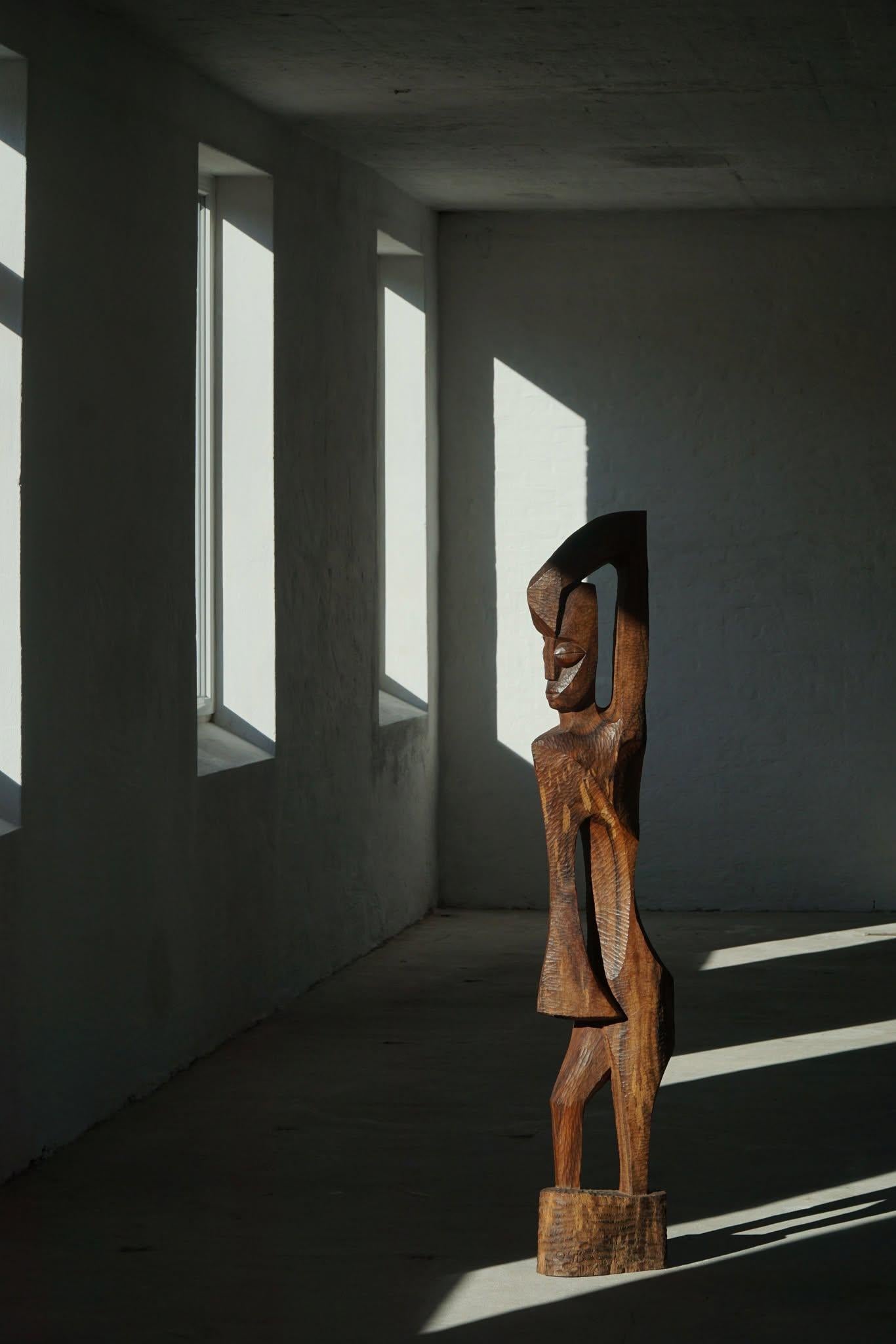 A large sculptural figurative shaped wooden sculpture, hand carved by a Danish artist in the 1960s. Made in rosewood. 

A beautiful decorative and rare object for the modern interior. A warm color and patina that pairs well with the minimalist