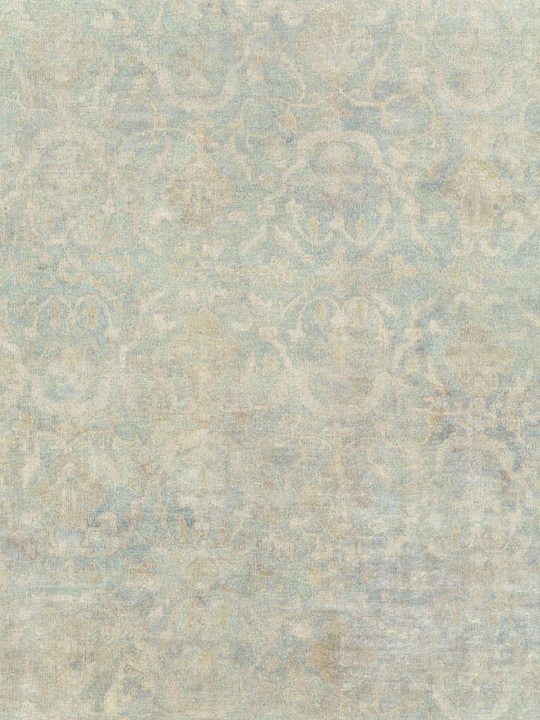 An antique Chinese handmade rug from the early 20th century in shades of seafoam blue and seafoam green.

Measures: 10' 1