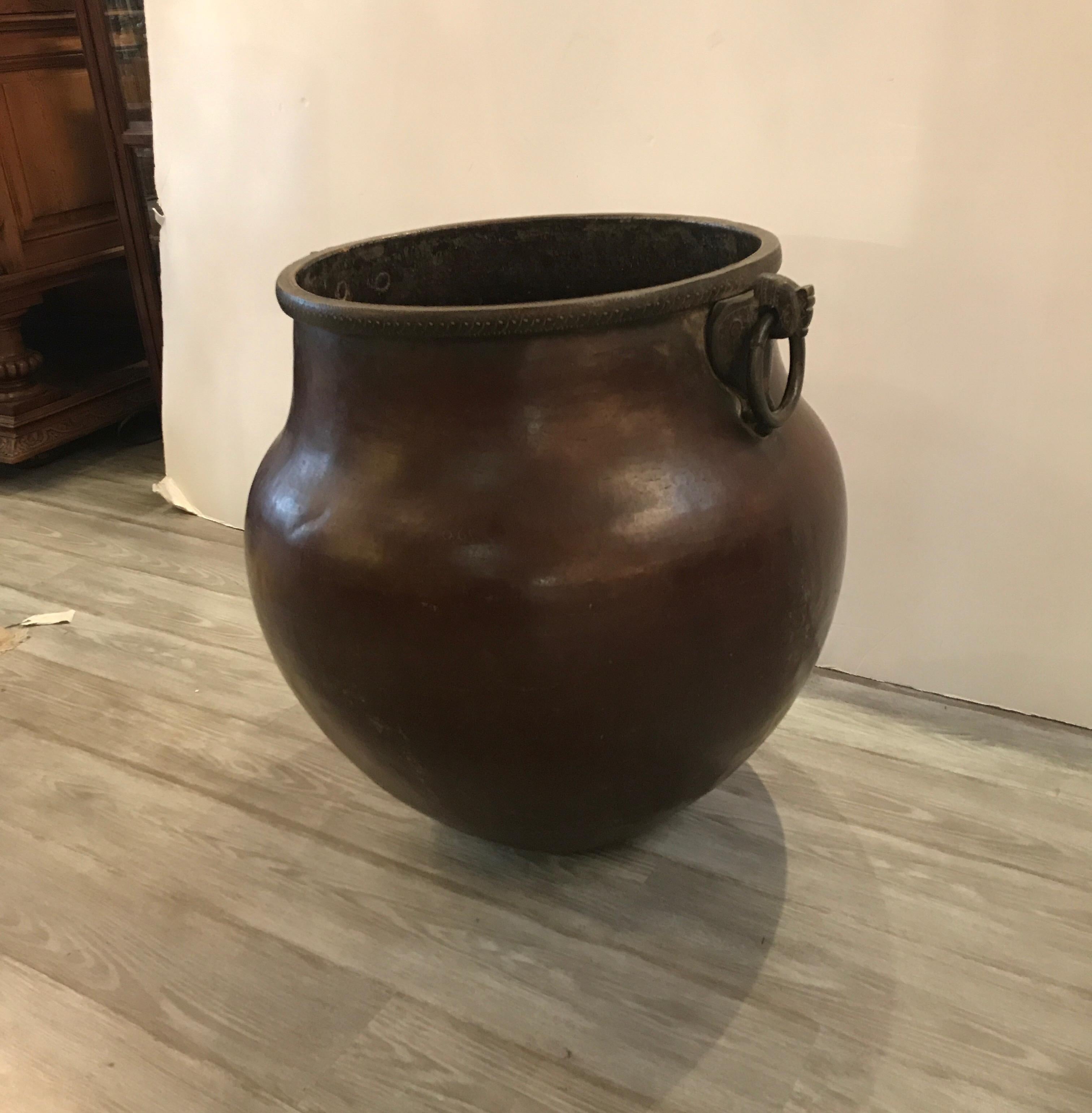 Large copper pot with iron trim and handles for 1890, made in Turkey. Great overall original condition with nice even patintation and tight dovetailed seams, the interior is aged and oxidized. The interior shows the hand-hammered construction with