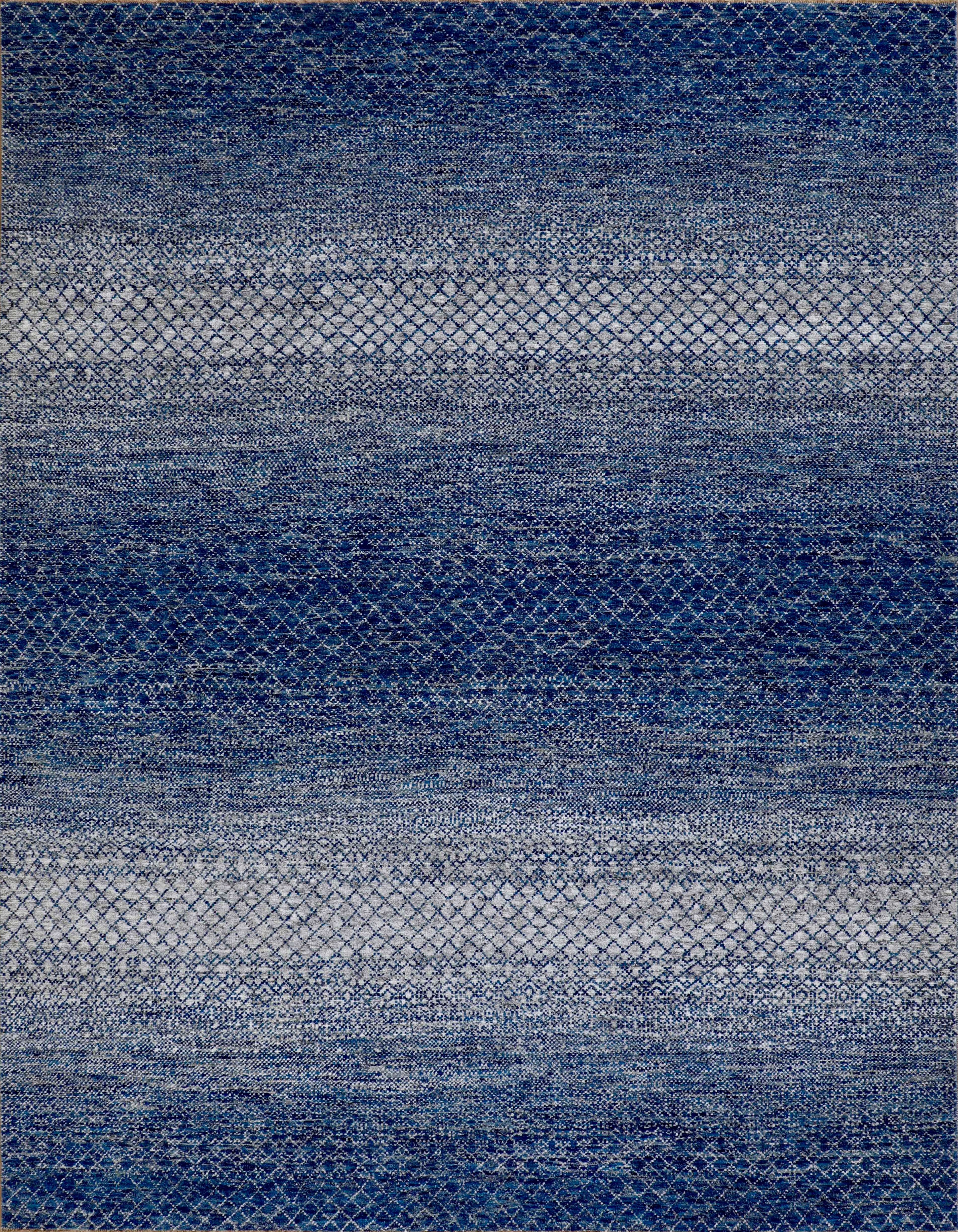 Grand tapis en laine fait à la main dans des tons bleus superposés avec une texture géométrique subtile