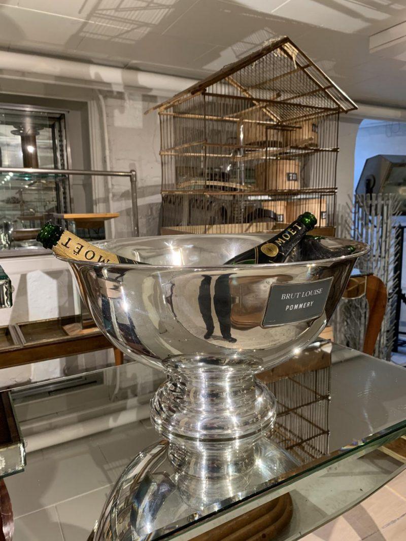 Large handsome bowl-shaped and silver-plated champagne cooler, raised on a base. Made for the well-regarded champagne house Pommery, founded in Reims and whose roots date back to 1858. This particular cooler dates from around the end of the last