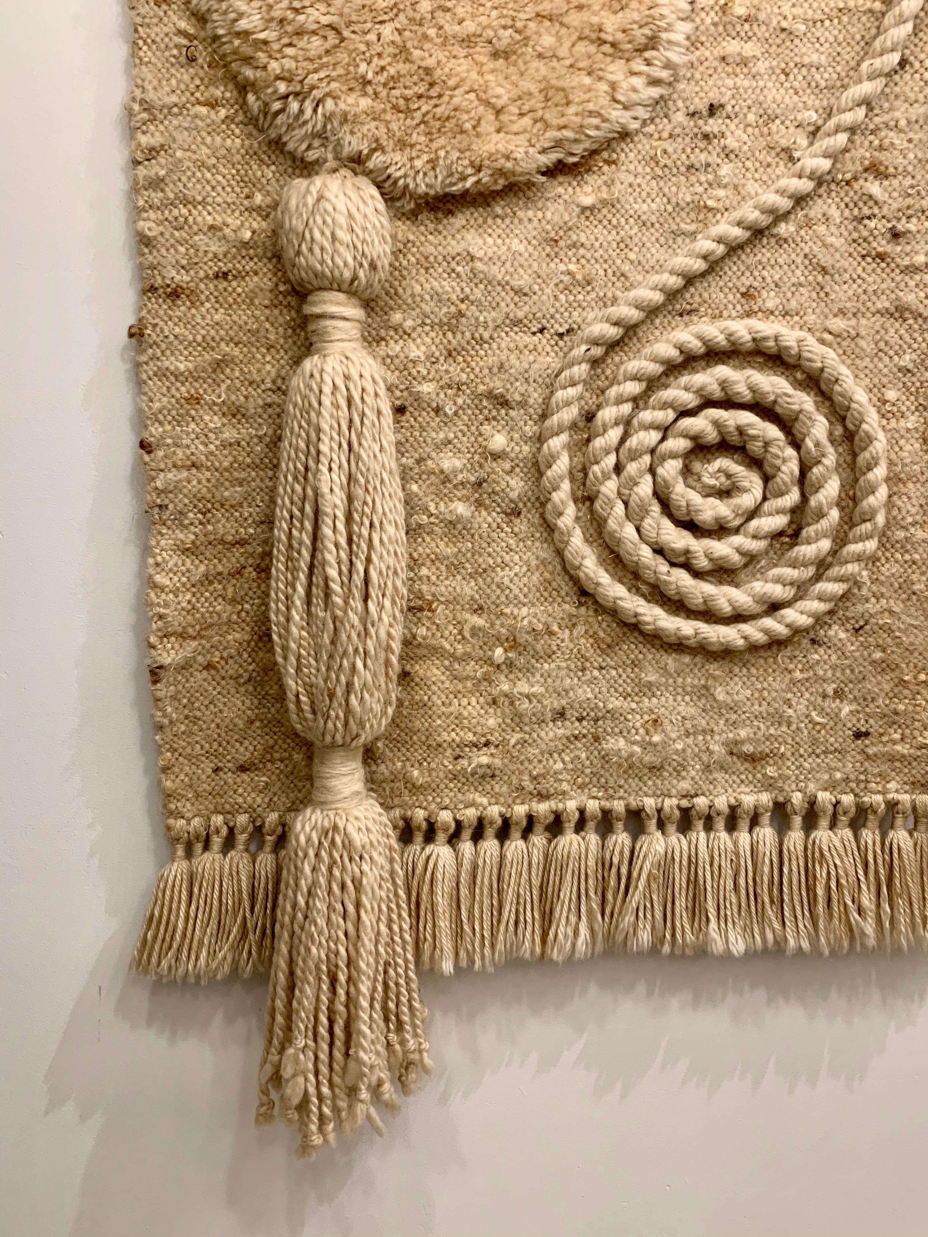 This is an outstanding handwoven wool art piece with extraordinary details and textures in 100% wool (earth tones).
This oversized piece is mounted on a custom designed metal bracket with brushed brass knobs (see detail images).  Extremely well
