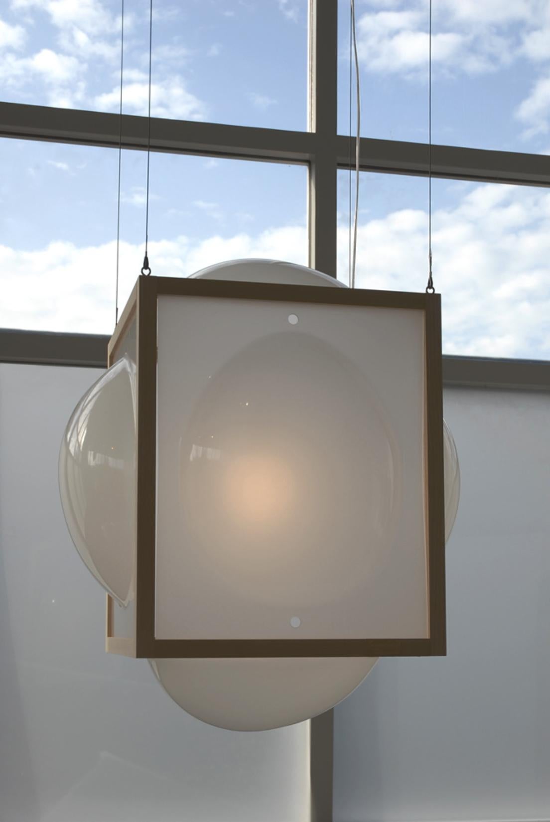 Large hanging Curator Opaque lamp by Studio Thier & van Daalen
Dimensions: W 115 x D 115 x H 120 cm
Materials: Ash, Acrylic glass, glass
Also available: Extra options available

These bubbles in a wooden frame brighten up your day! As if your