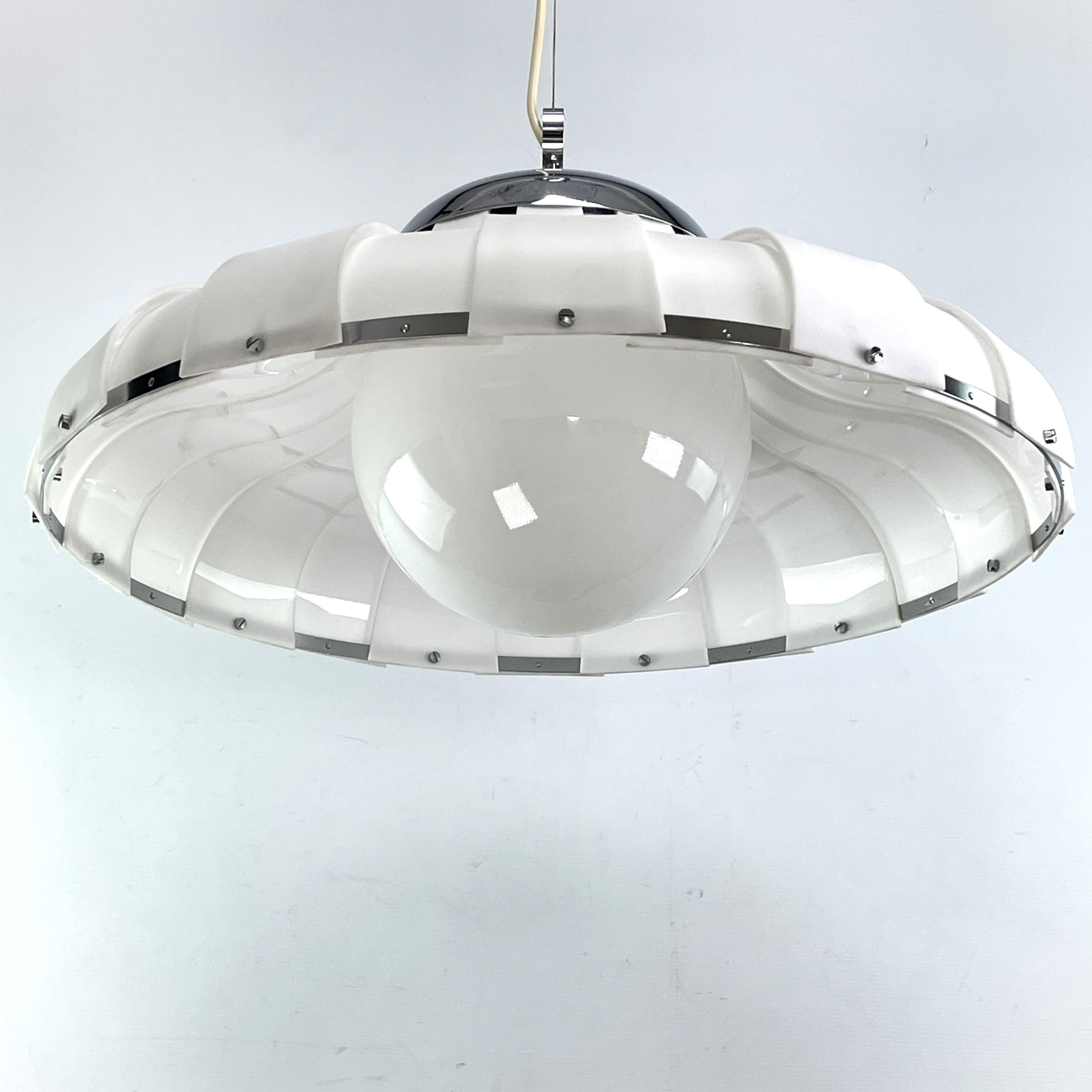 ceiling lamp by Harvey Guzzini for Mablo - 1970s.

This beautiful lamp is a real design classic from the 70s. This lamp with its unusual design is a highlight for any lounge interior.
This model was designed by Harvey Guzzini and comes from the
