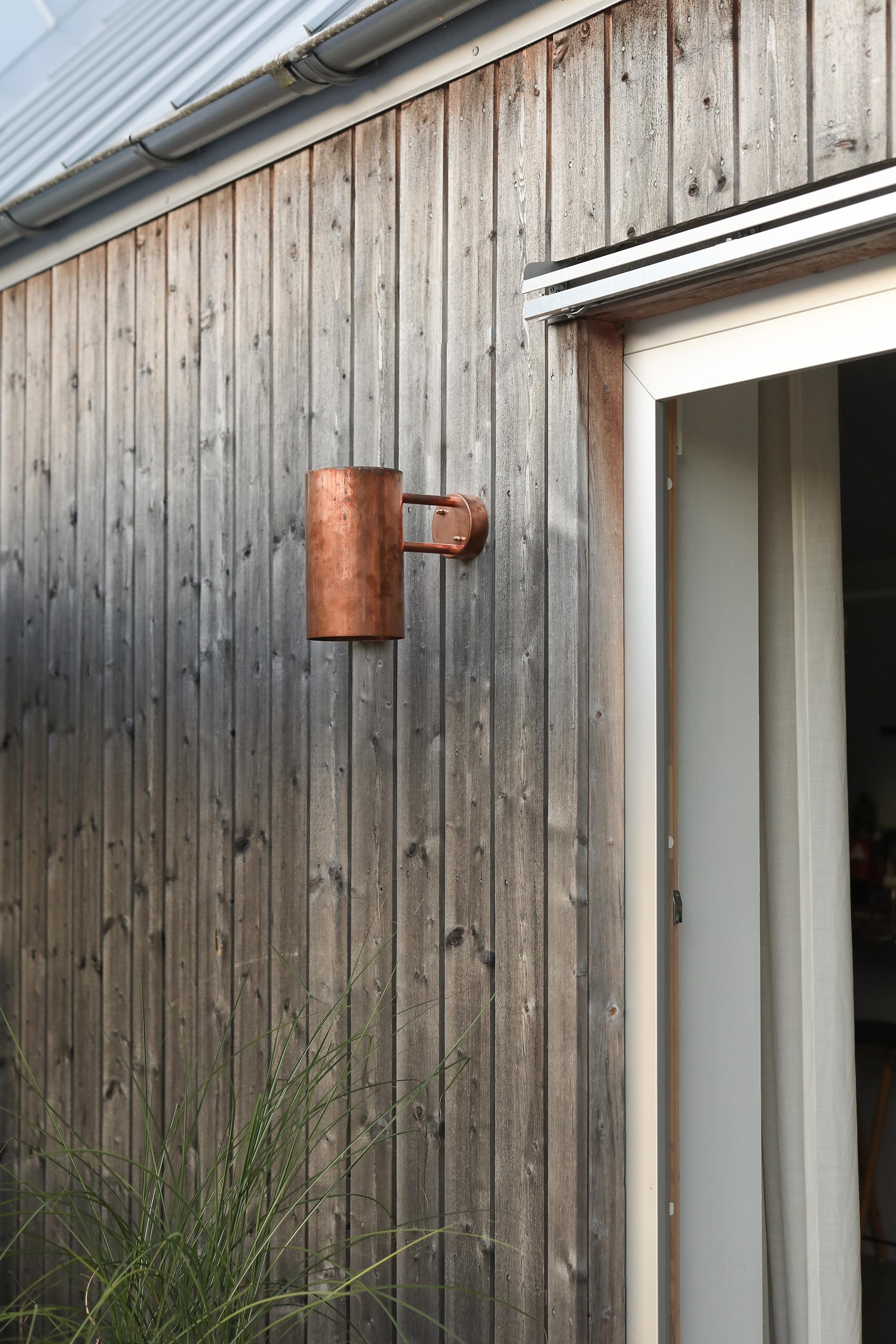 Large Hans-Agne Jakobsson C 627 'Rulle' raw copper outdoor sconce. An exclusive made for U.S. and UL listed authorized re-edition of the classic Swedish design executed in raw unlacquered and unpolished copper. An incredibly refined design that is