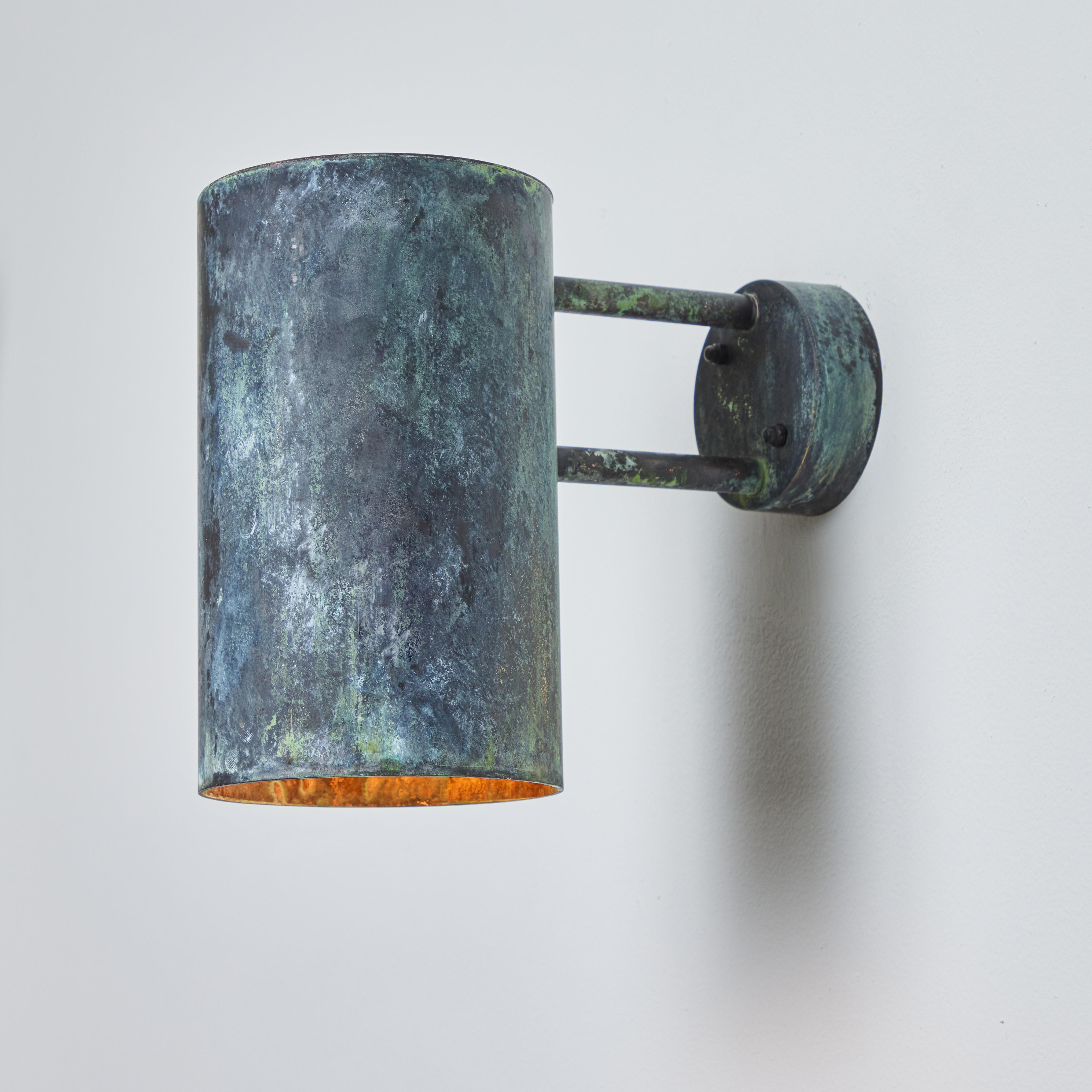 Large Hans-Agne Jakobsson C 627 'Rulle' darkly patinated outdoor sconce. An exclusive made for U.S. and UL listed authorized re-edition of the classic Swedish design executed in darkly patinated metal with raw unlacquered metal interior. An