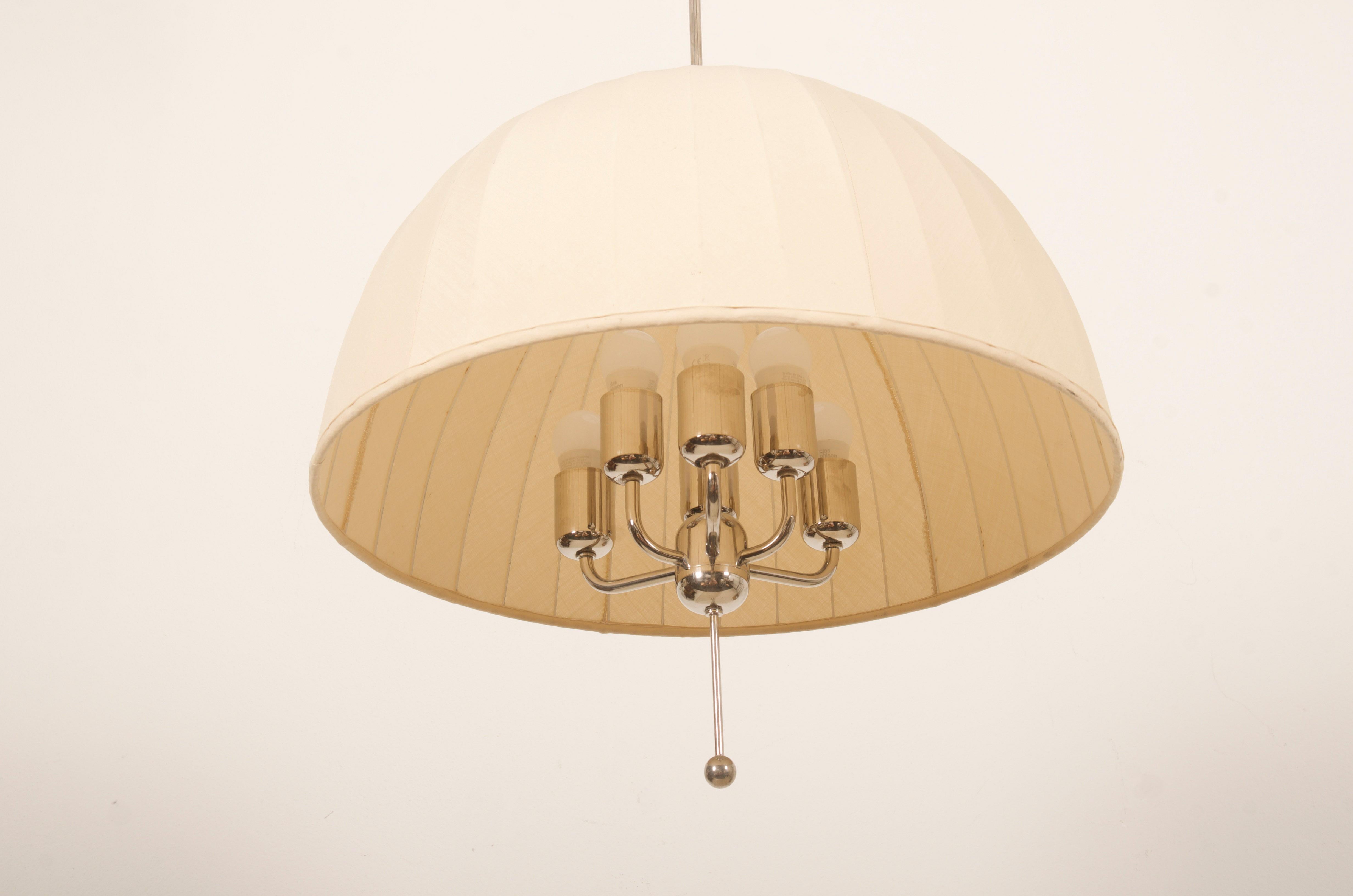 Rare large ceiling pendant with shade in cream/yellow fabric on white lacquered metal mount. 
Model Carolin T549/6 in chrom designed 1963 by Hans-Agne Jakobsson. Lamp itself and the shade are height adjustable.
6 x E27 bulbs.