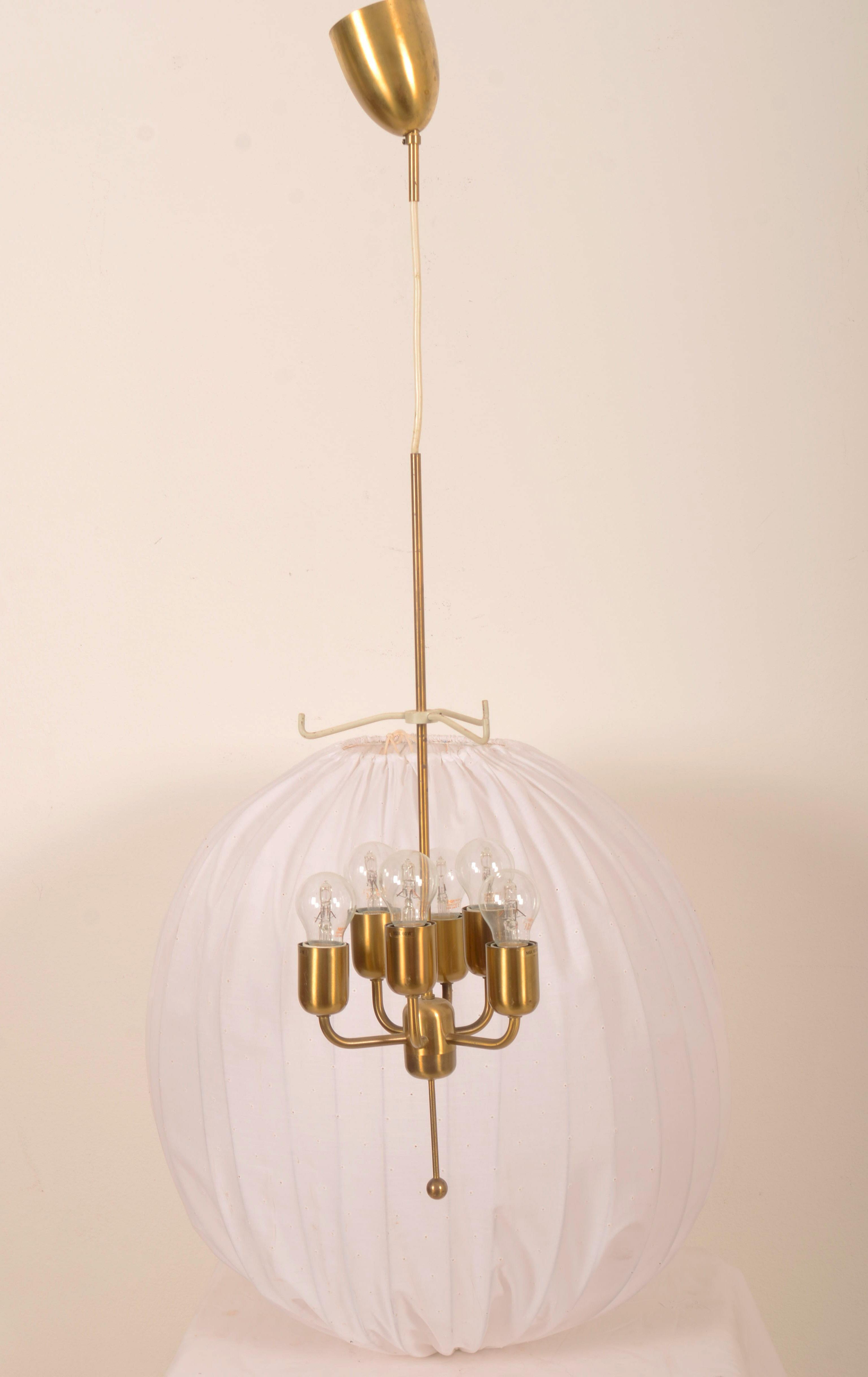 Rare large ceiling pendant with spheric shade in cream/white fabric on white lacquered metal mount. 
Model Carolin T549/6 in brass designed 1963 by Hans-Agne Jakobsson. Lamp itself and the shade are height adjustable.
6 x E27 bulbs.