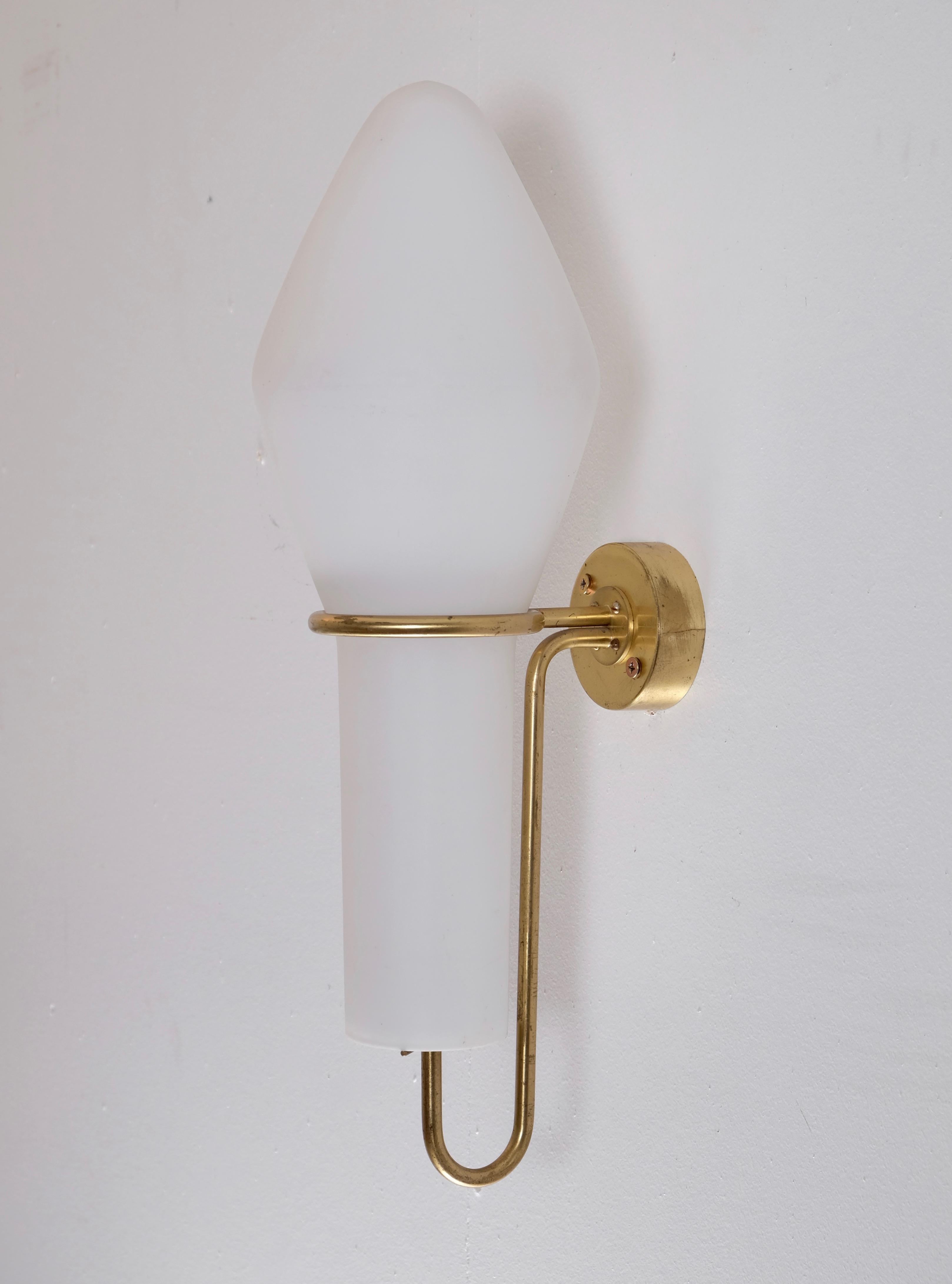 Rare opaline glass wall light produced and designed by Hans-Agne Jakobsson, Markaryd, Sweden, 1950s.
Measures: Height 50 cm.
Please note: Listed price is for one (1) wall light.  