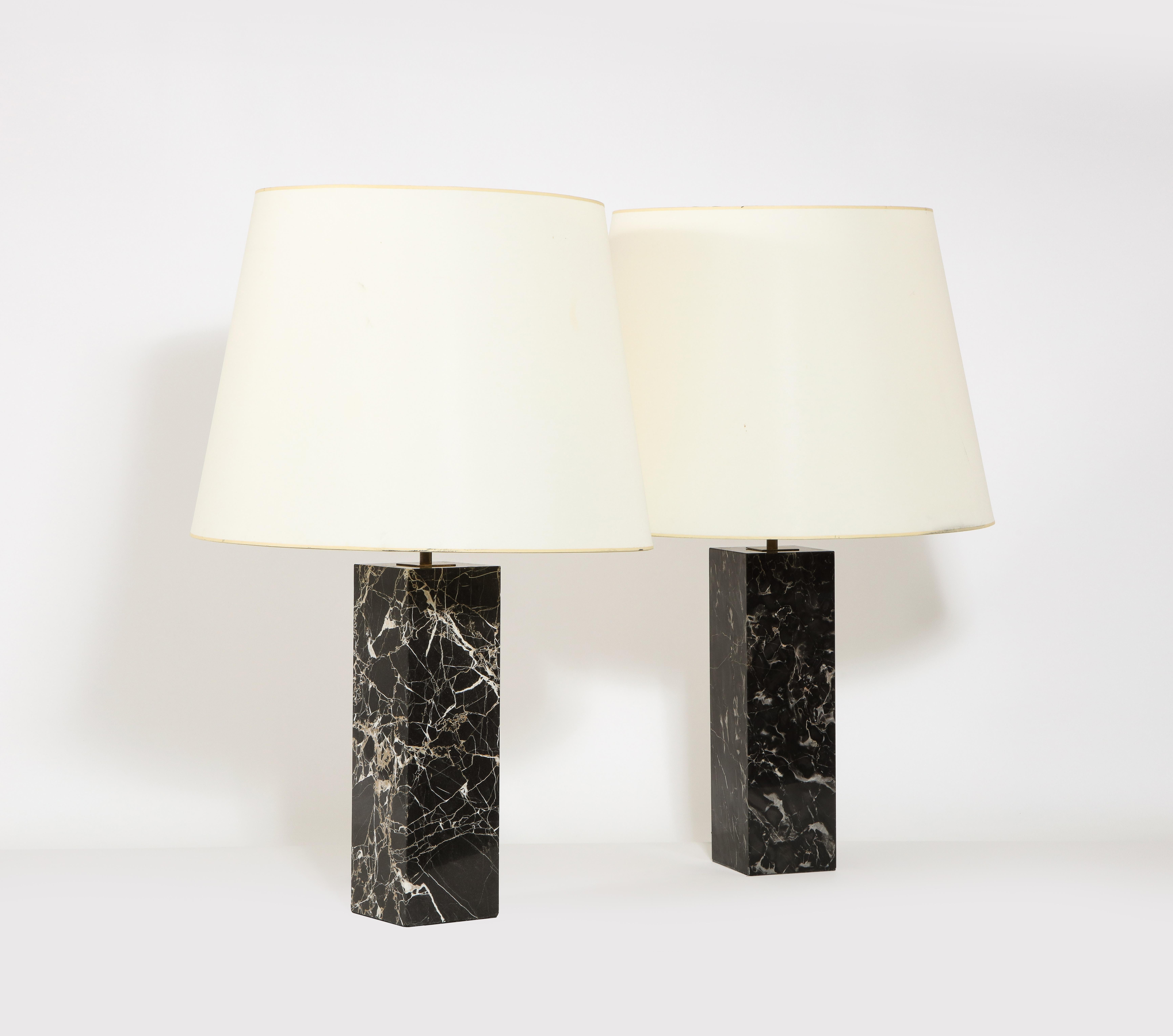 Large pair of Hansen table lamps in beautifully veined marble with brass hardware. Shades are for photographic purposes. A single is also available separately.