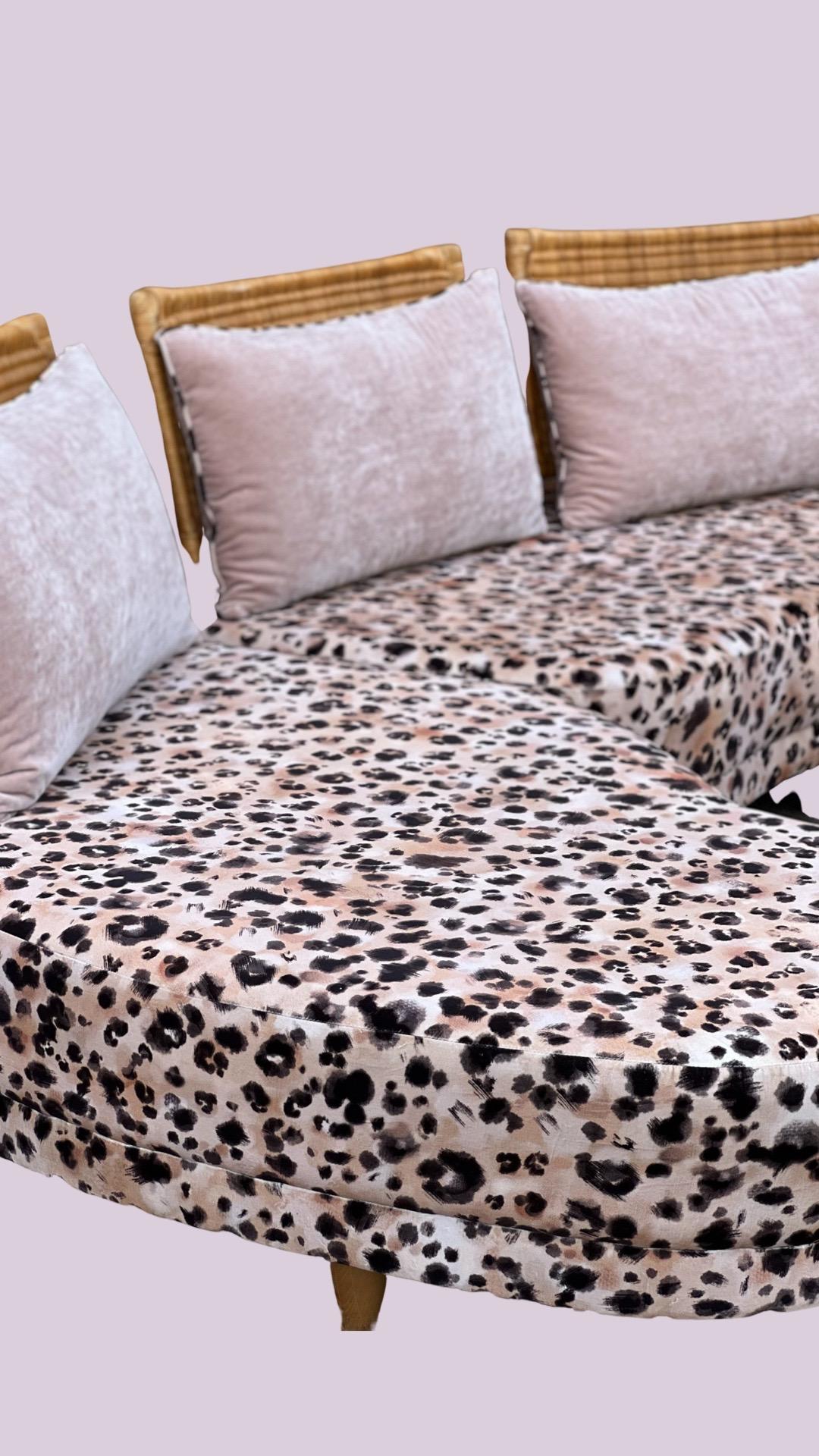 Wonderful 1980s Harrods curved sofa that has been recovered in our very own leopard print velvet. 3 removable cane backs which are covered with blush pink cushions and leopard print piping.

Wood feet.


Sofa comes in two sections for ease of moving