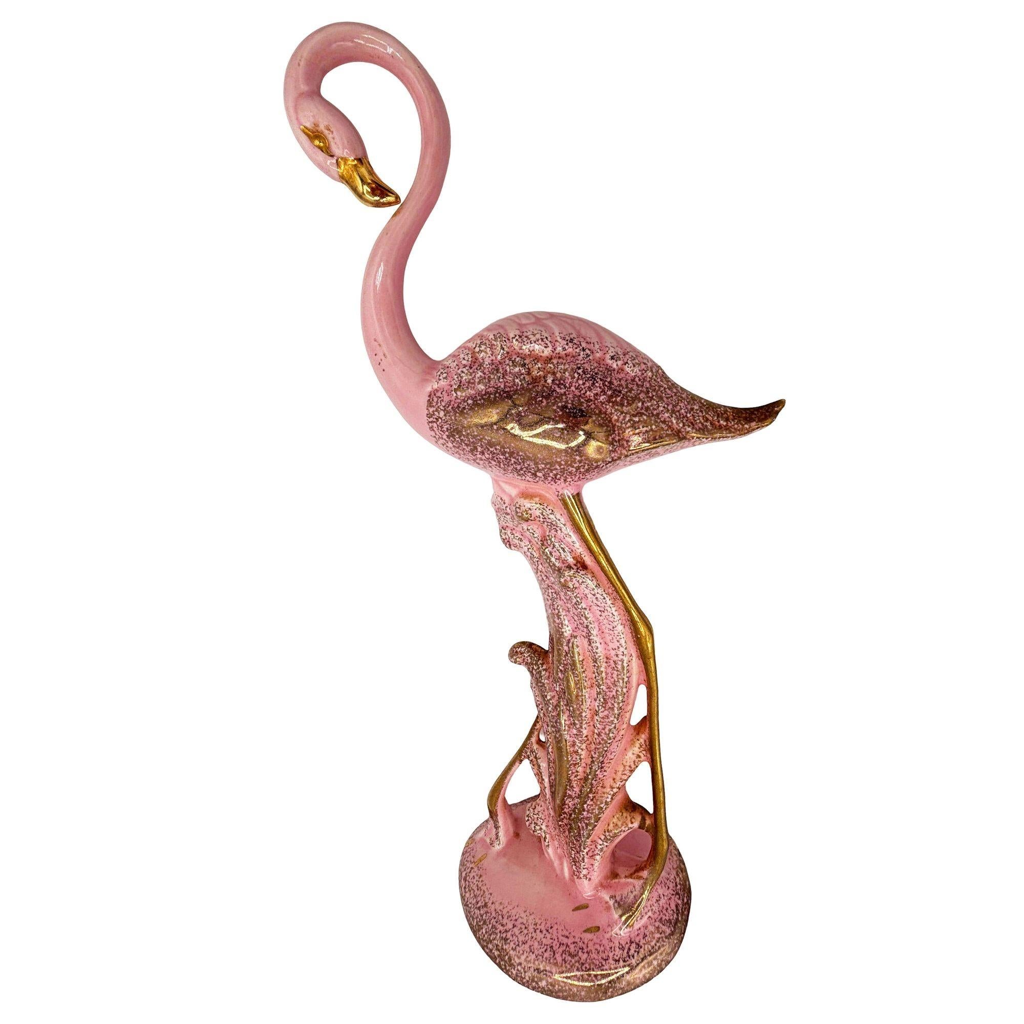 Rare Hawaiian Pottery Modernist pink and gold long-legged flamingo ceramic figurine by Found Memories in Kailua-Kona, Hawaii. The statue detailed a pink flamingo with long legs, a slim, tall form standing on a grassy field. It comes in a gloss