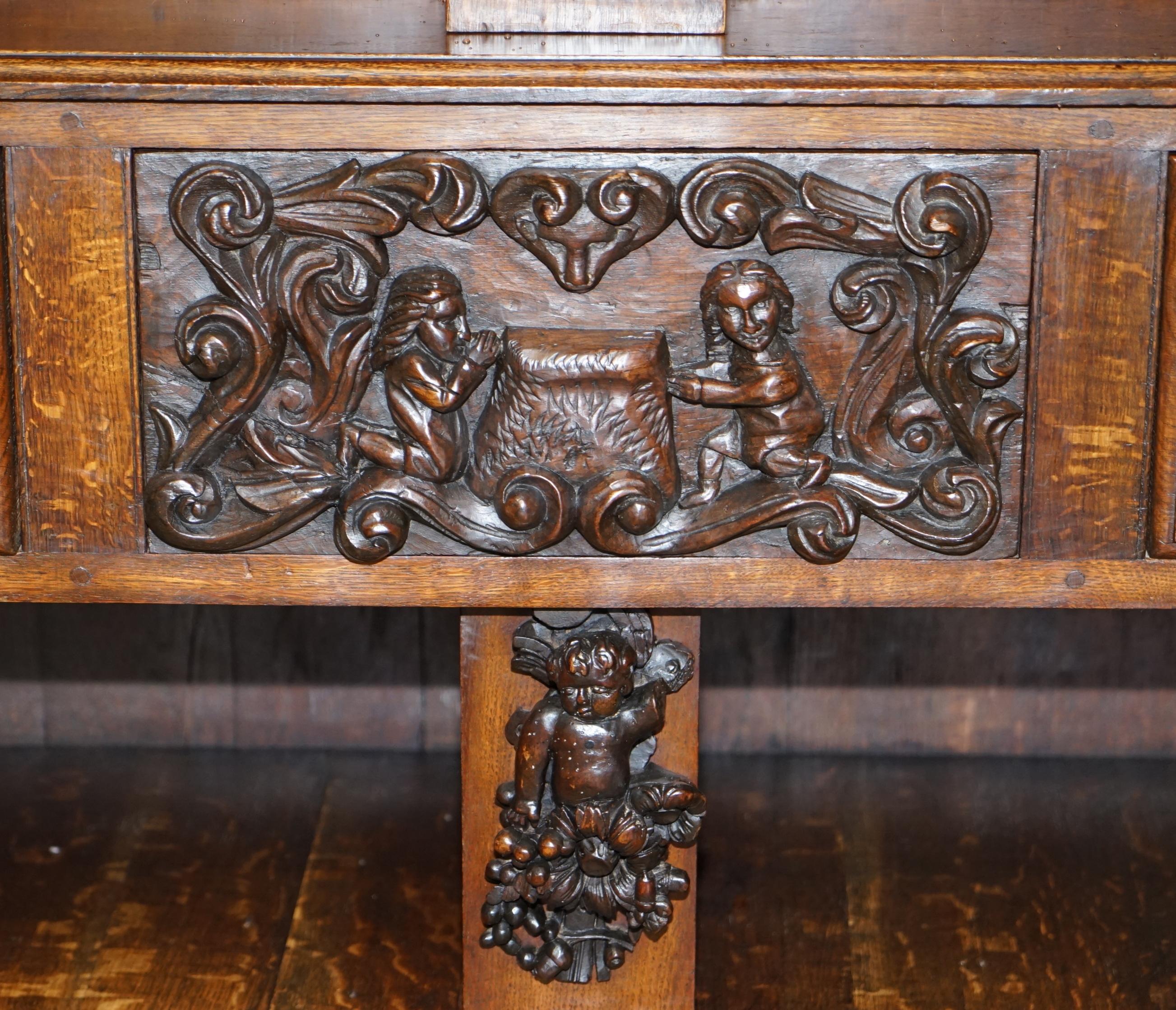 Large Heavily Carved Bookcase Cupboard with Ornate Cherub Putti & Lion Figures For Sale 1