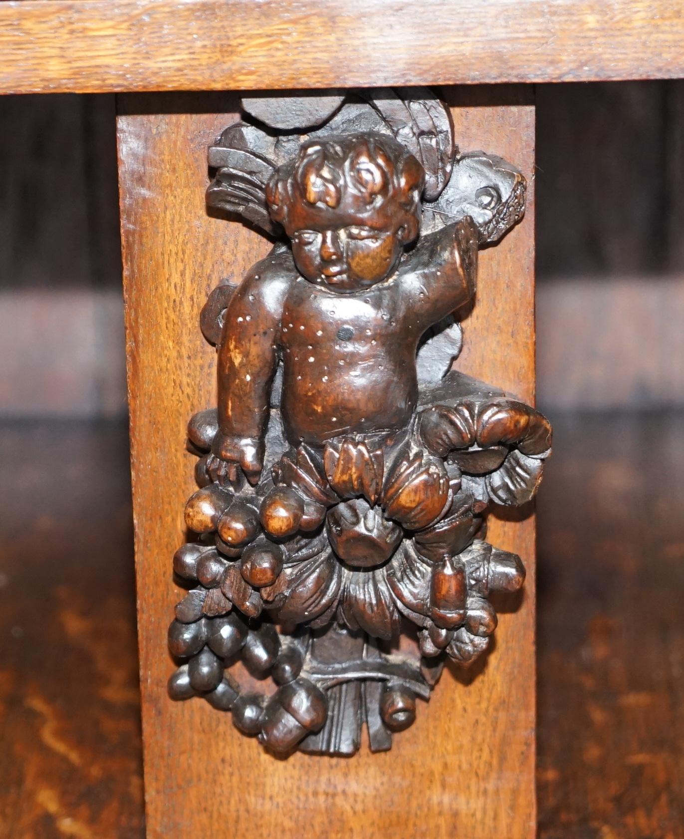 Large Heavily Carved Bookcase Cupboard with Ornate Cherub Putti & Lion Figures For Sale 1