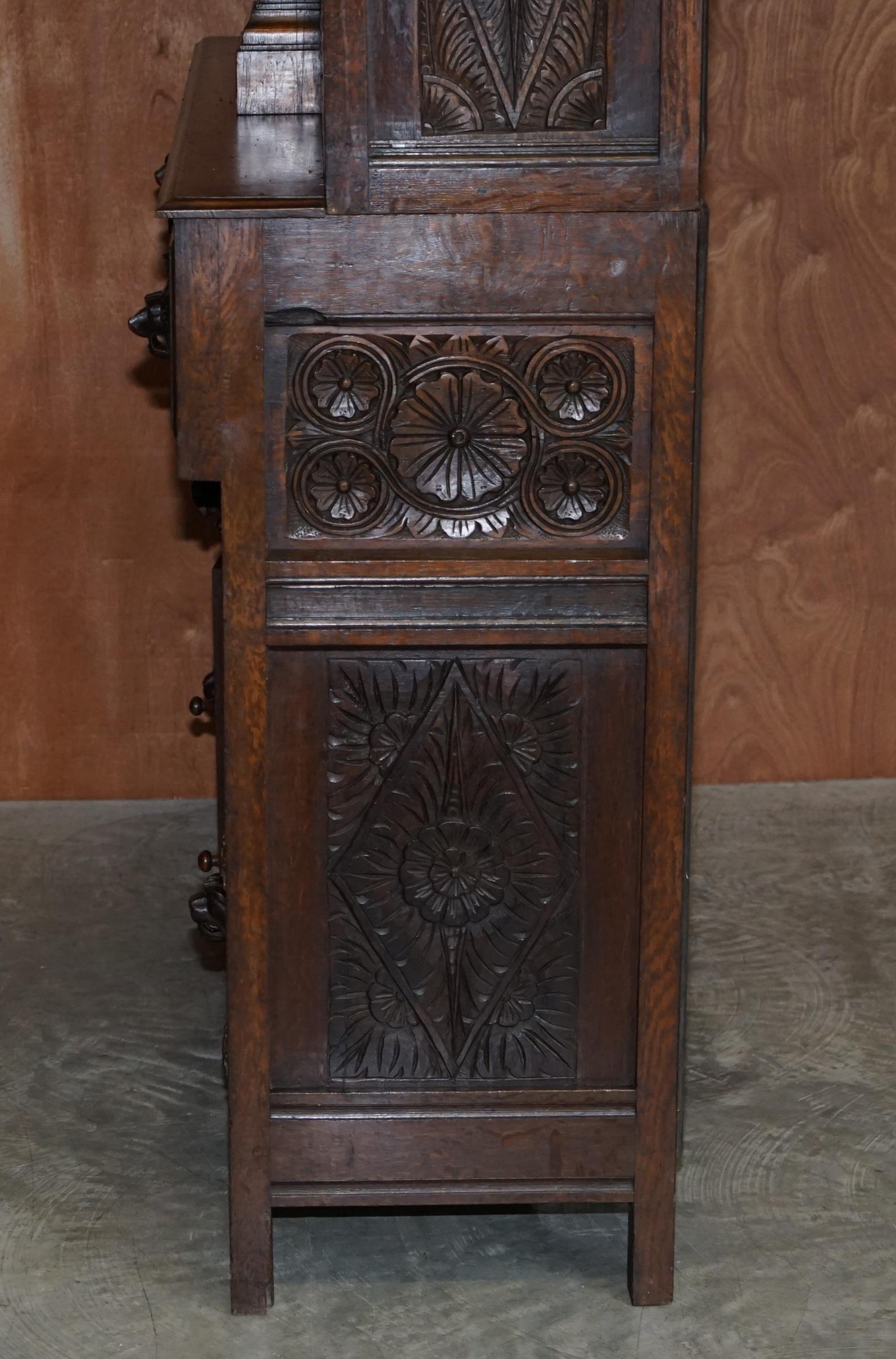 Large Heavily Carved Bookcase Cupboard with Ornate Cherub Putti & Lion Figures For Sale 7