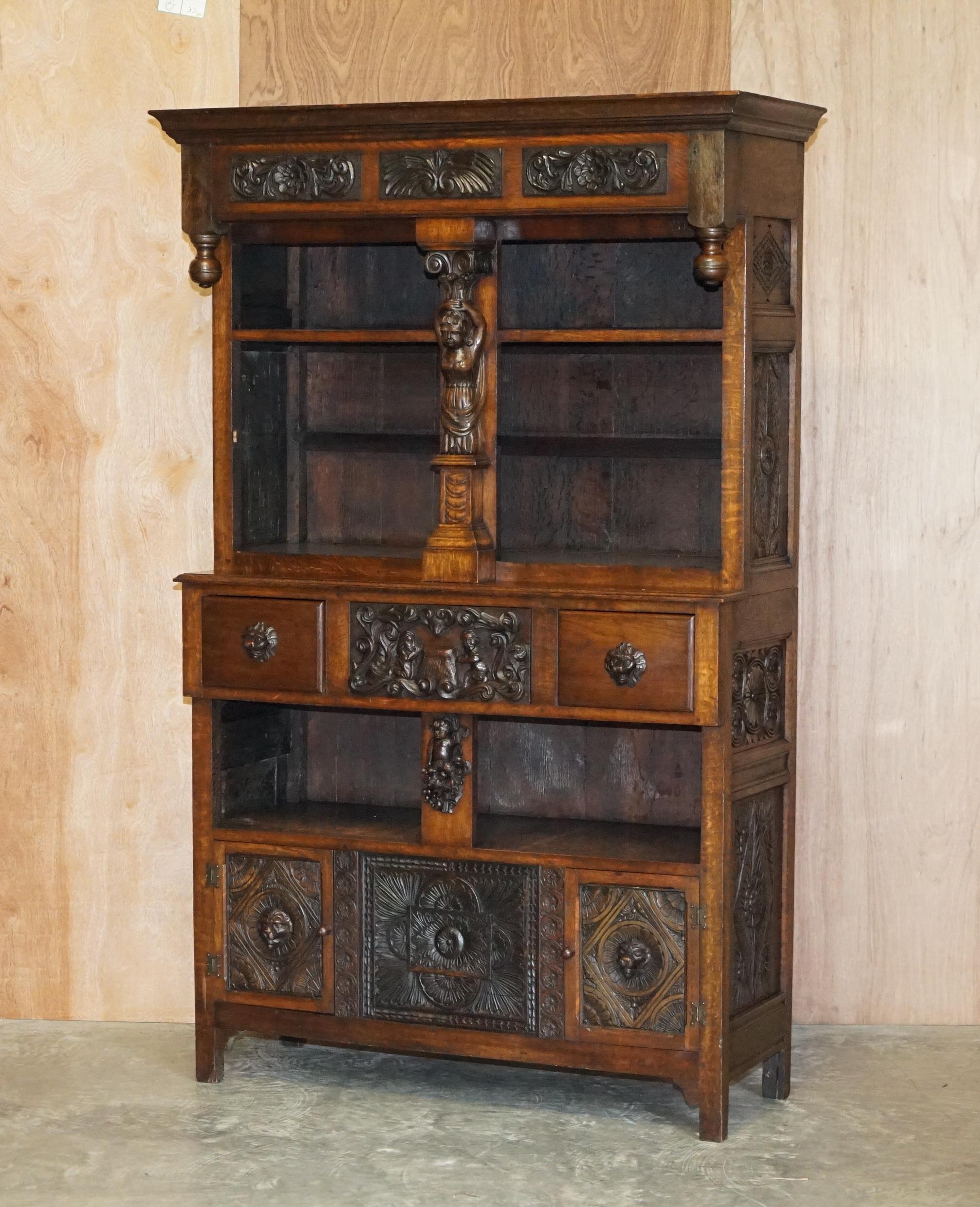We are delighted to offer for this lovely heavily carved Italian bookcase pot cupboard with Lions head and putti’s

A very charming and finely made piece of antique Italian furniture. Its in solid oak, it has various drawers doors and shelves