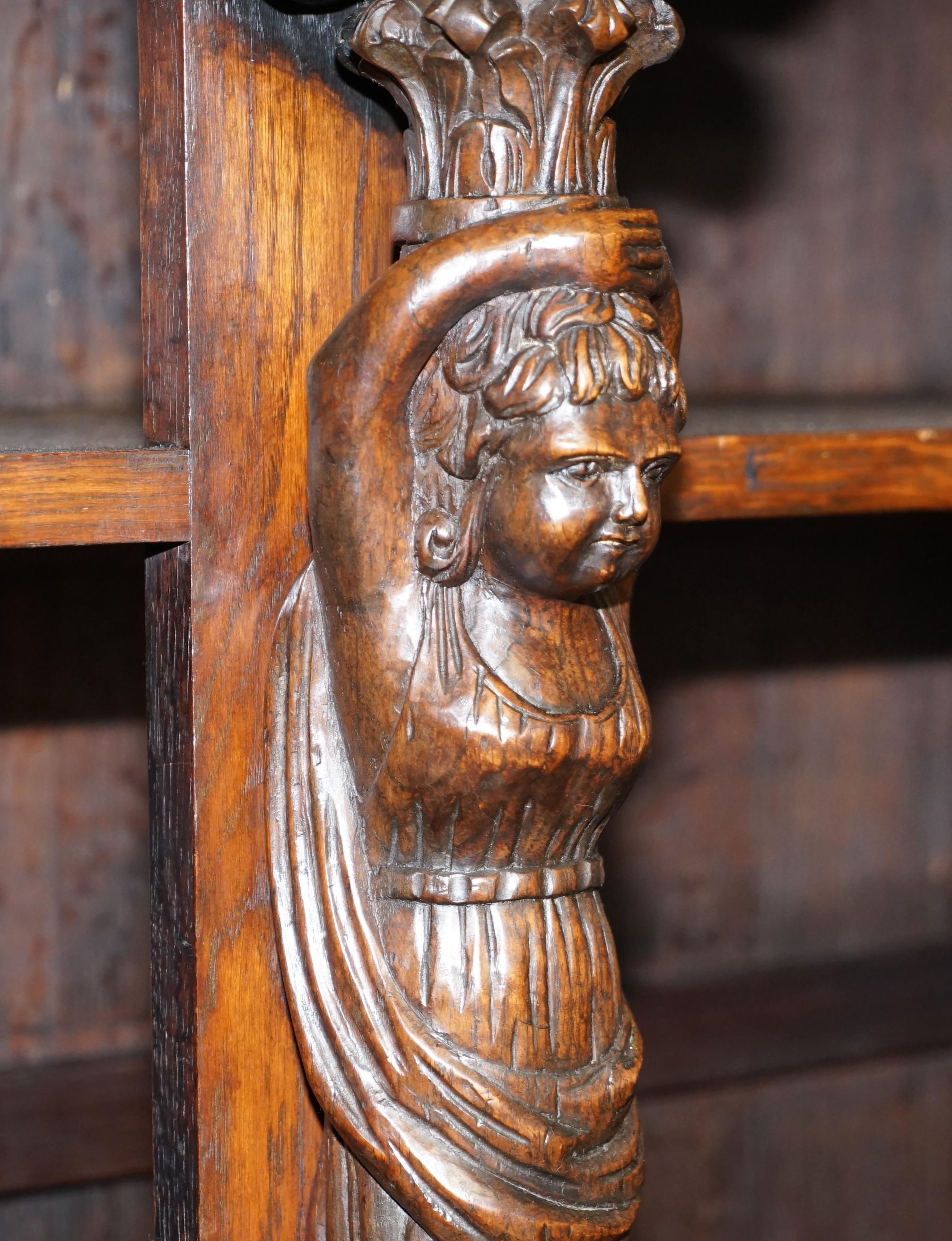 Italian Large Heavily Carved Bookcase Cupboard with Ornate Cherub Putti & Lion Figures For Sale