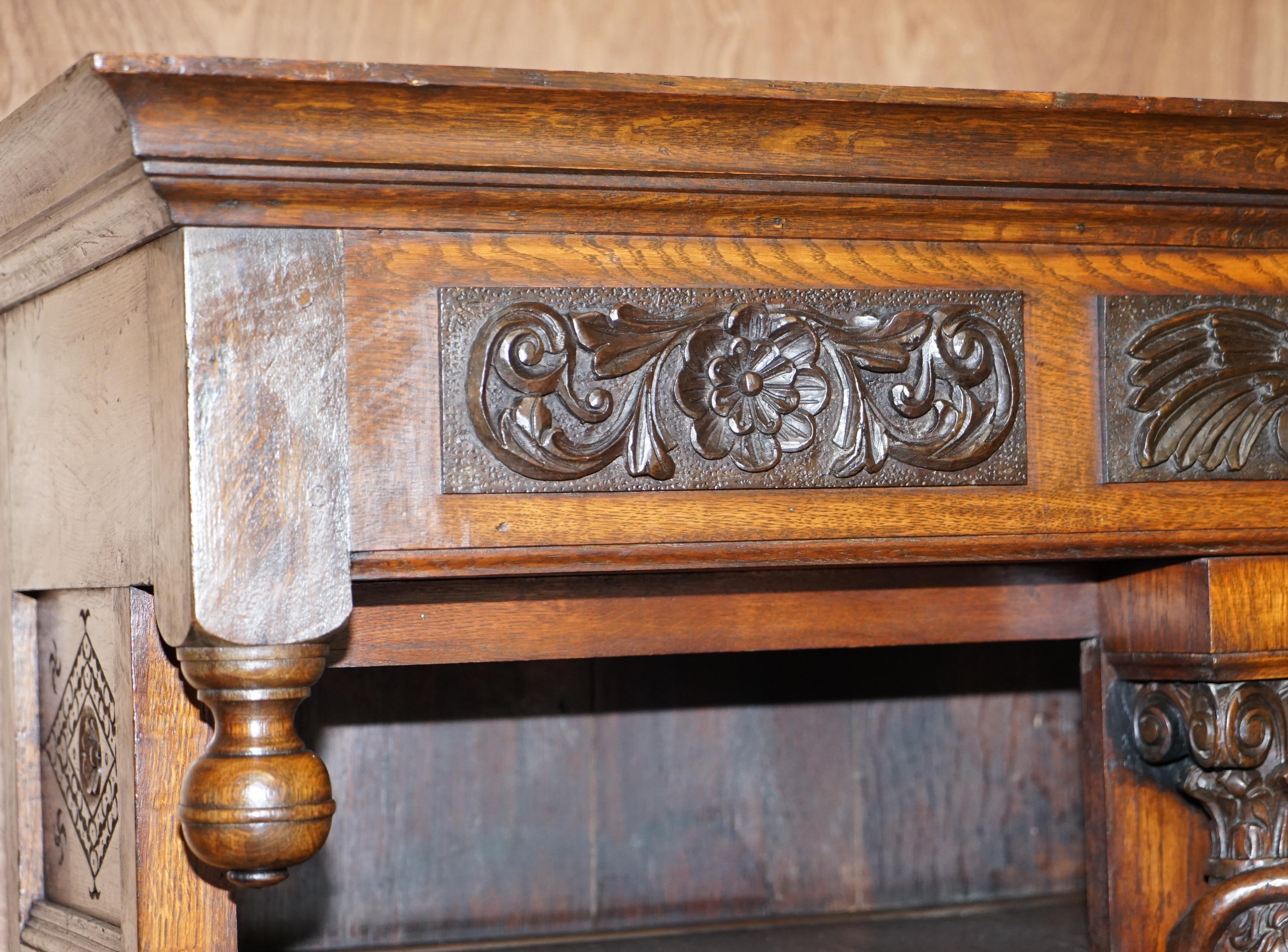 Hand-Crafted Large Heavily Carved Bookcase Cupboard with Ornate Cherub Putti & Lion Figures For Sale