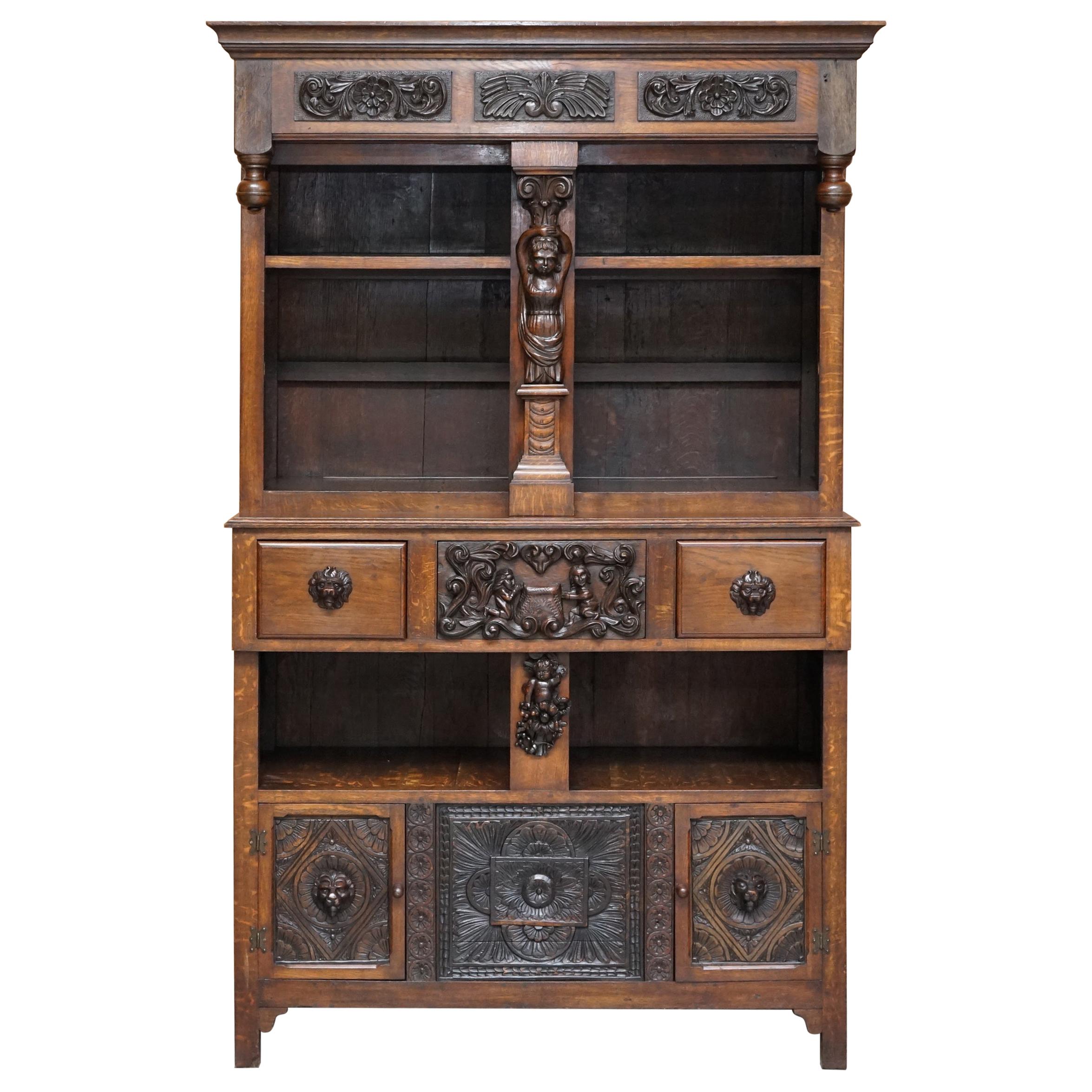 Large Heavily Carved Bookcase Cupboard with Ornate Cherub Putti & Lion Figures