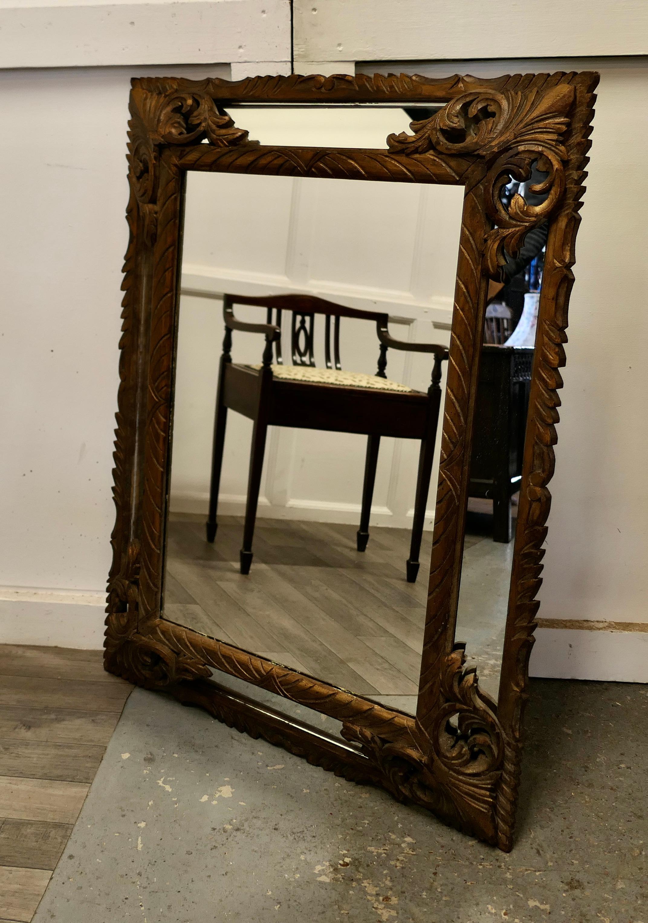 Large Heavily carved french oak gilt cushion mirror

A lovely Cushion mirror in carved gilt Oak, the 7” wide frame is set with mirrors and intricately carved with curving acanthus leaves 
The gilt surface of the carved wood has is slightly